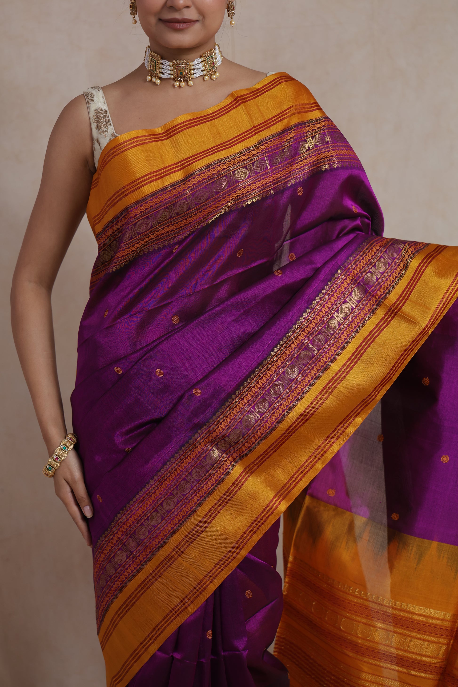 Portrait view of royal purple Kanchipuram Sico saree with mustard border