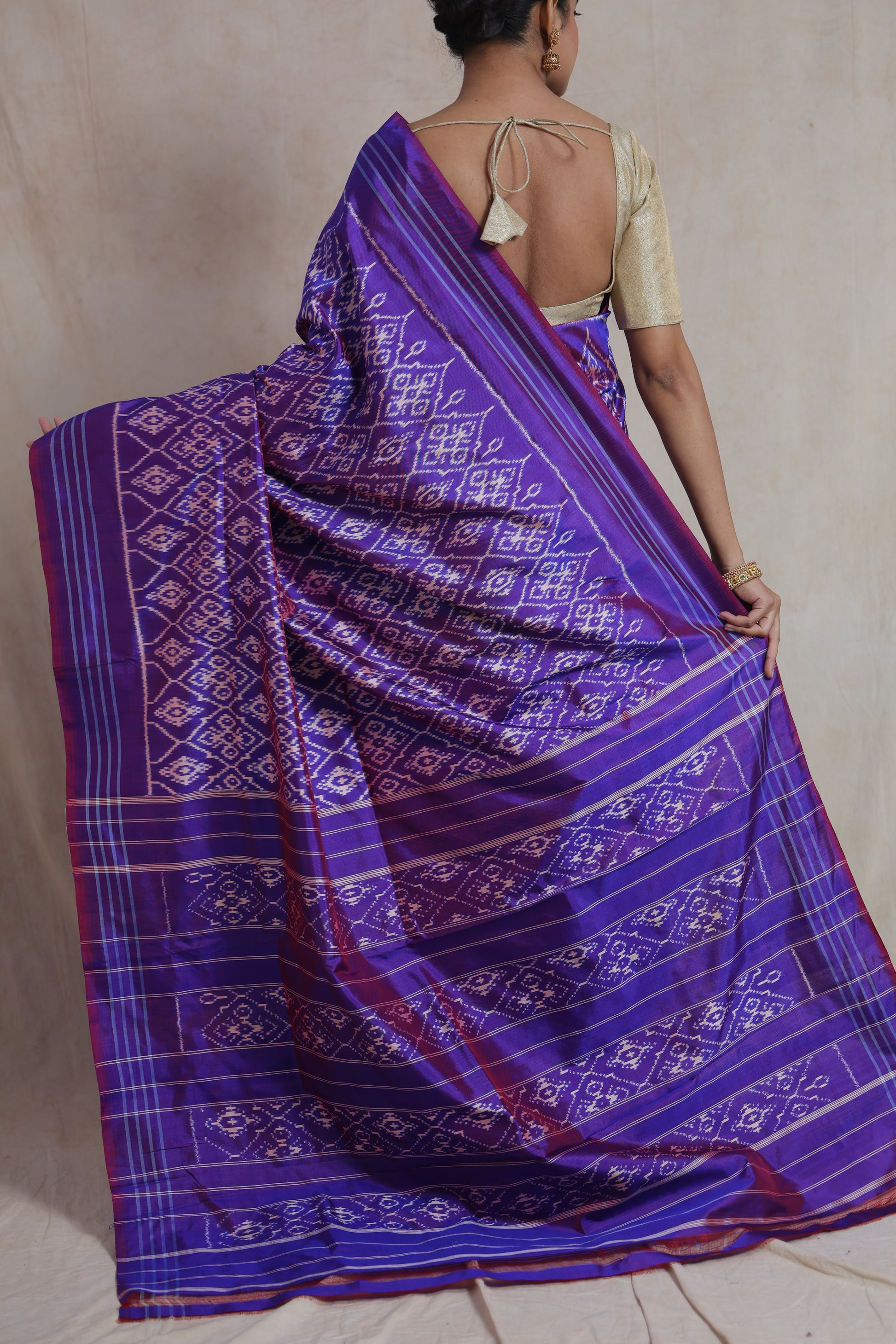 Back drape view of royal purple Panchampali silk saree with Ikat woven motifs