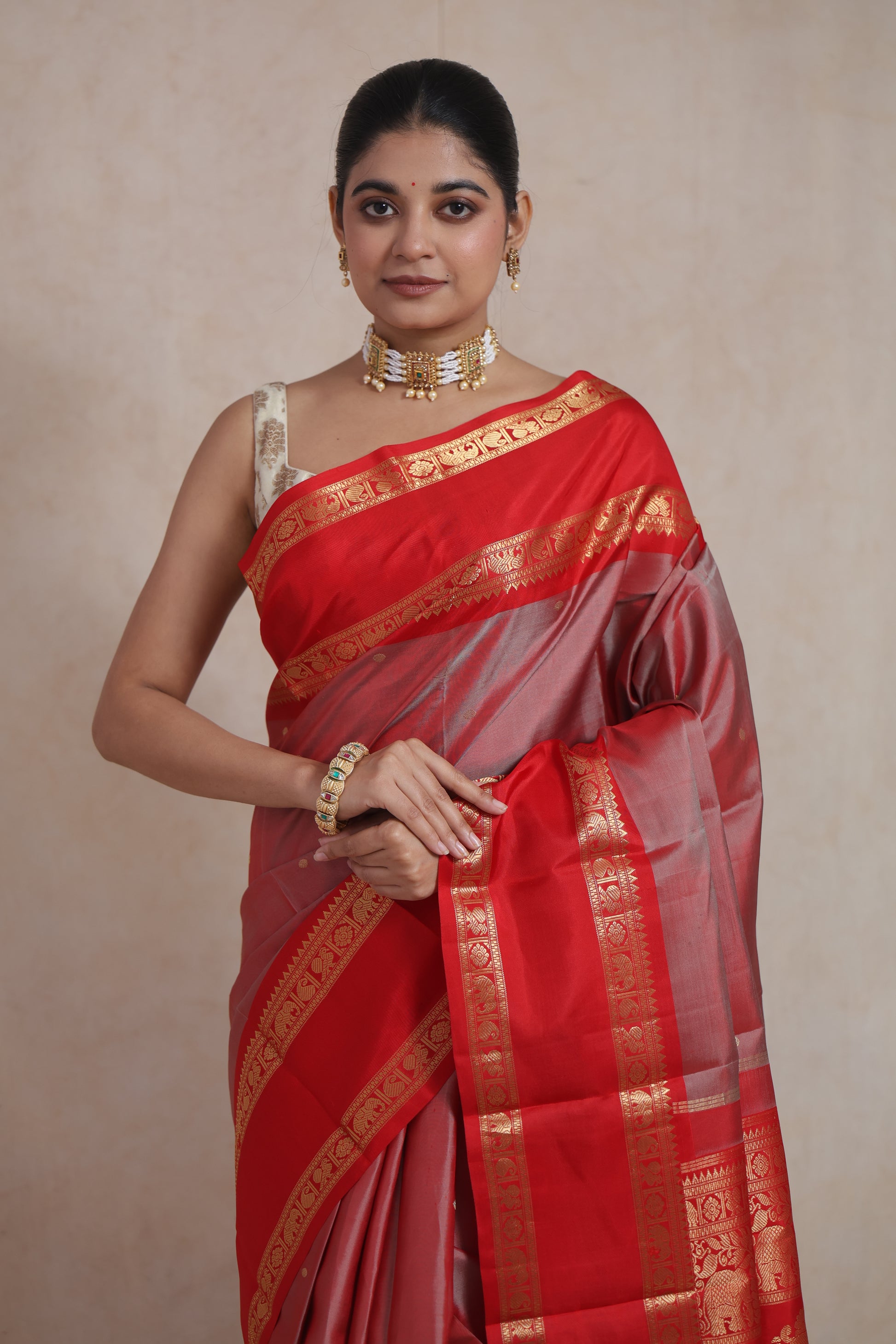 Back view of royal red Kanchiwaram silk saree with intricate zari woven pallu