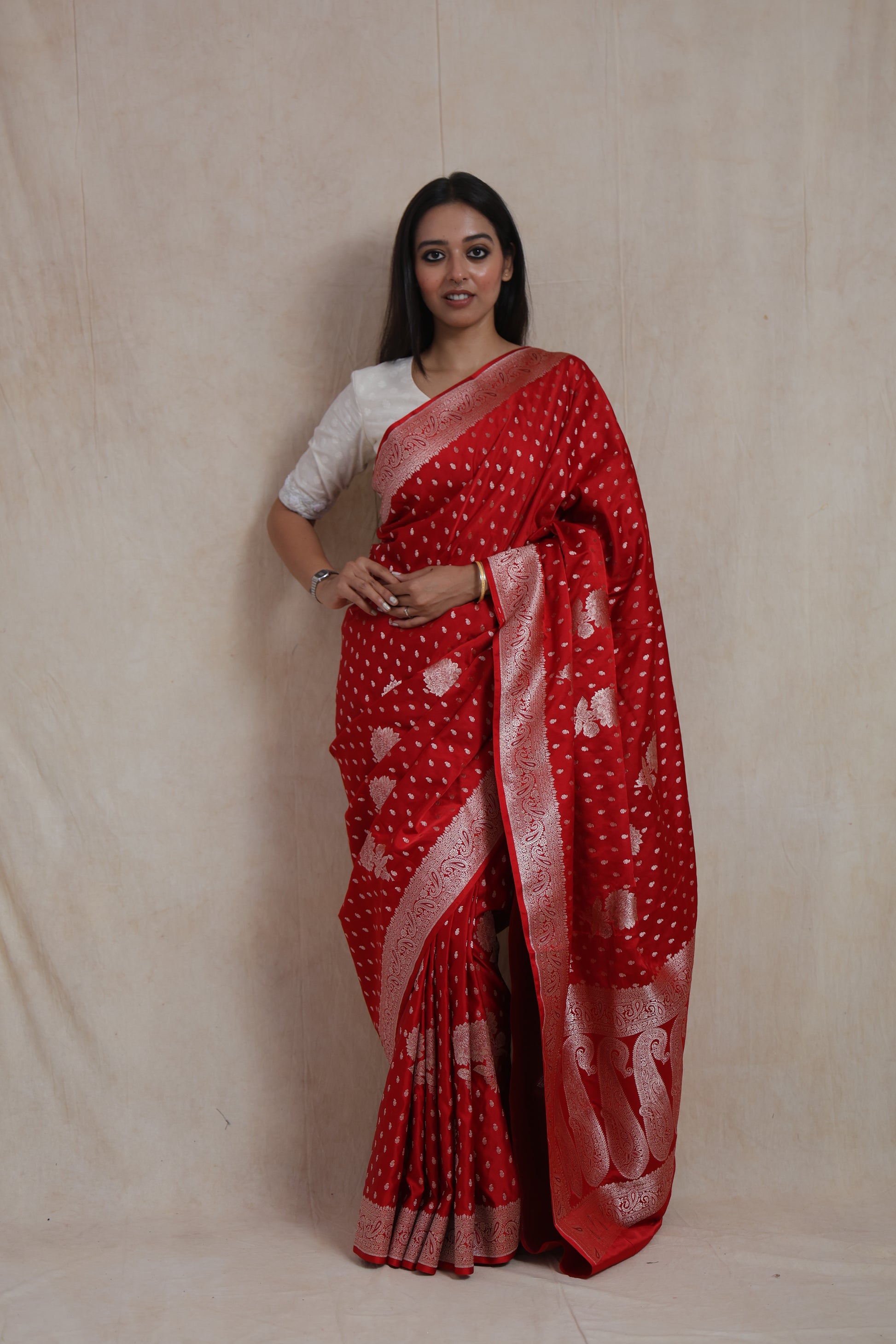 Front view of royal scarlet red Banarasi art silk saree with silver woven buttas and ornate border