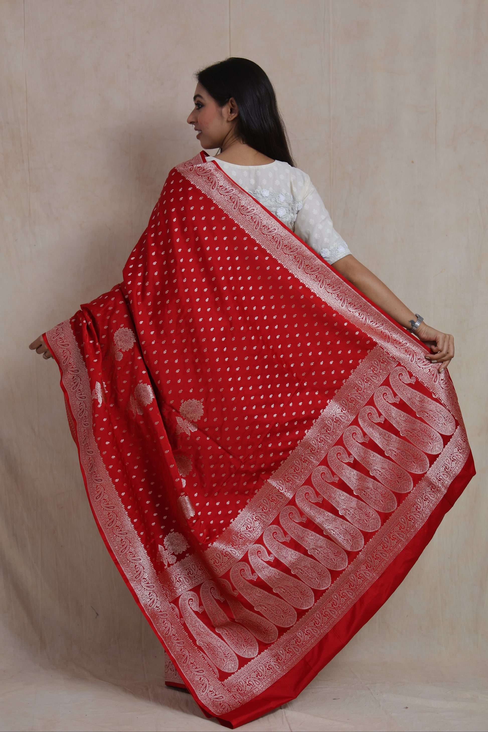 Back view showcasing intricate paisley woven pallu of a scarlet red Banarasi art silk saree