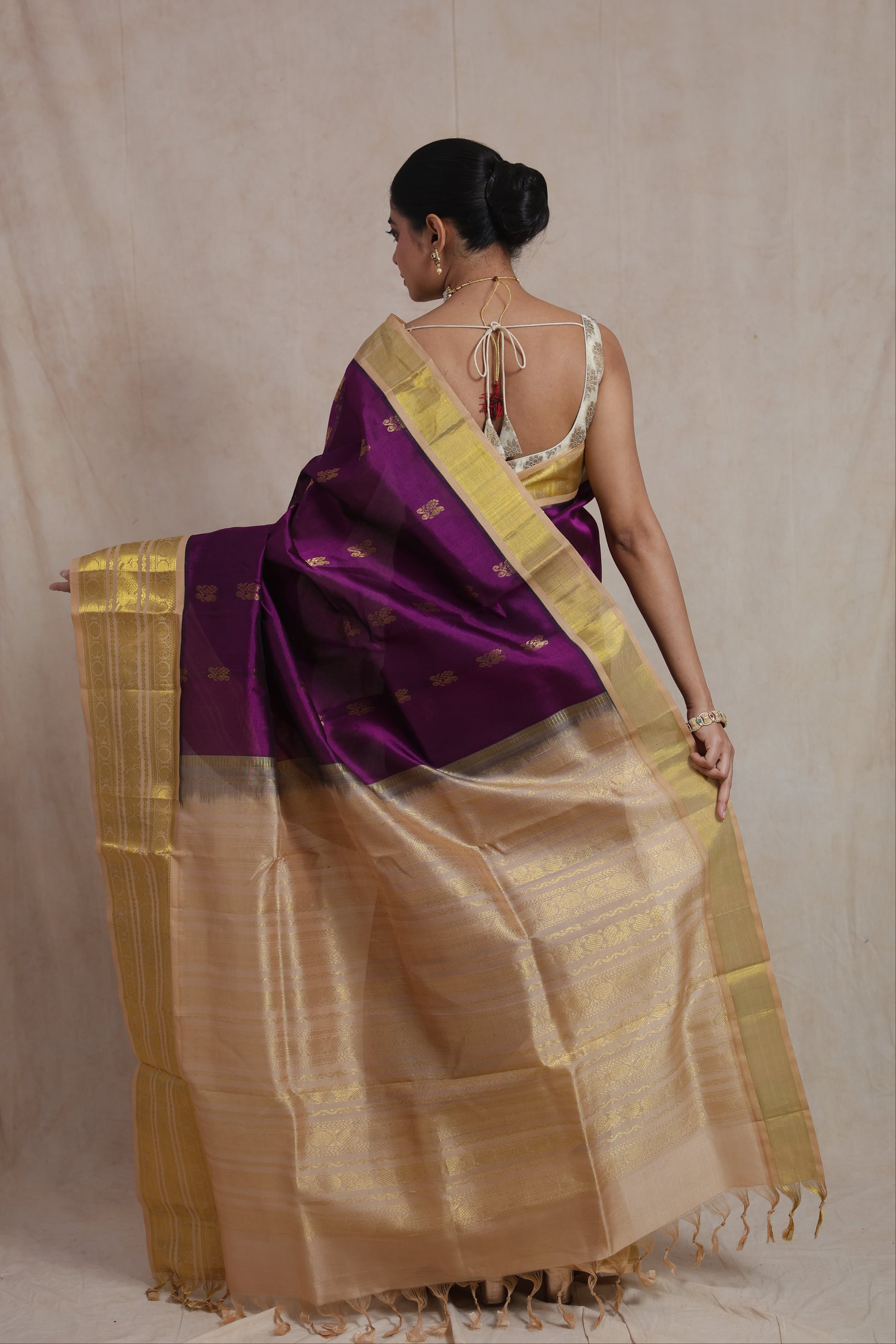 Back view of royal purple Kanchipuram SICO saree featuring a rich gold woven pallu and traditional border