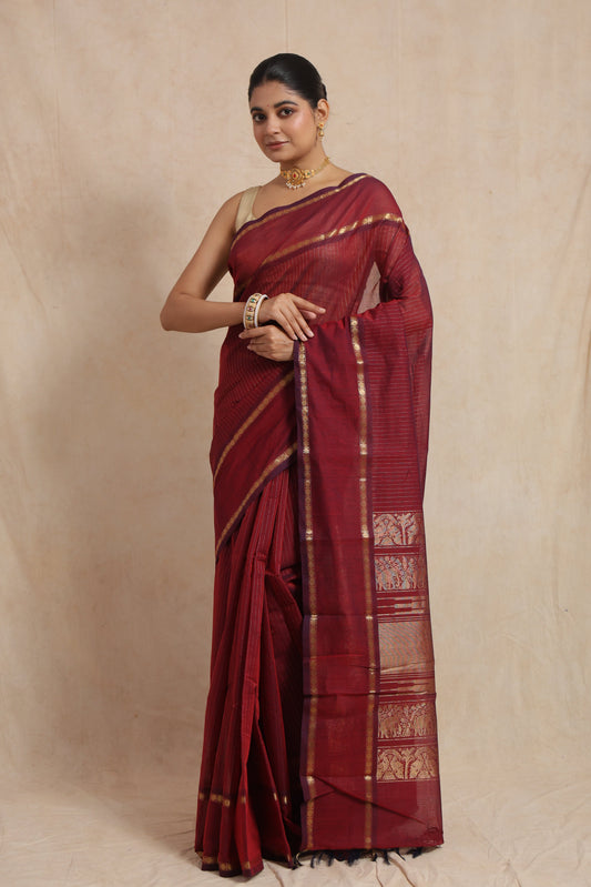 Classic pose in ruby red Kanchipuram cotton saree