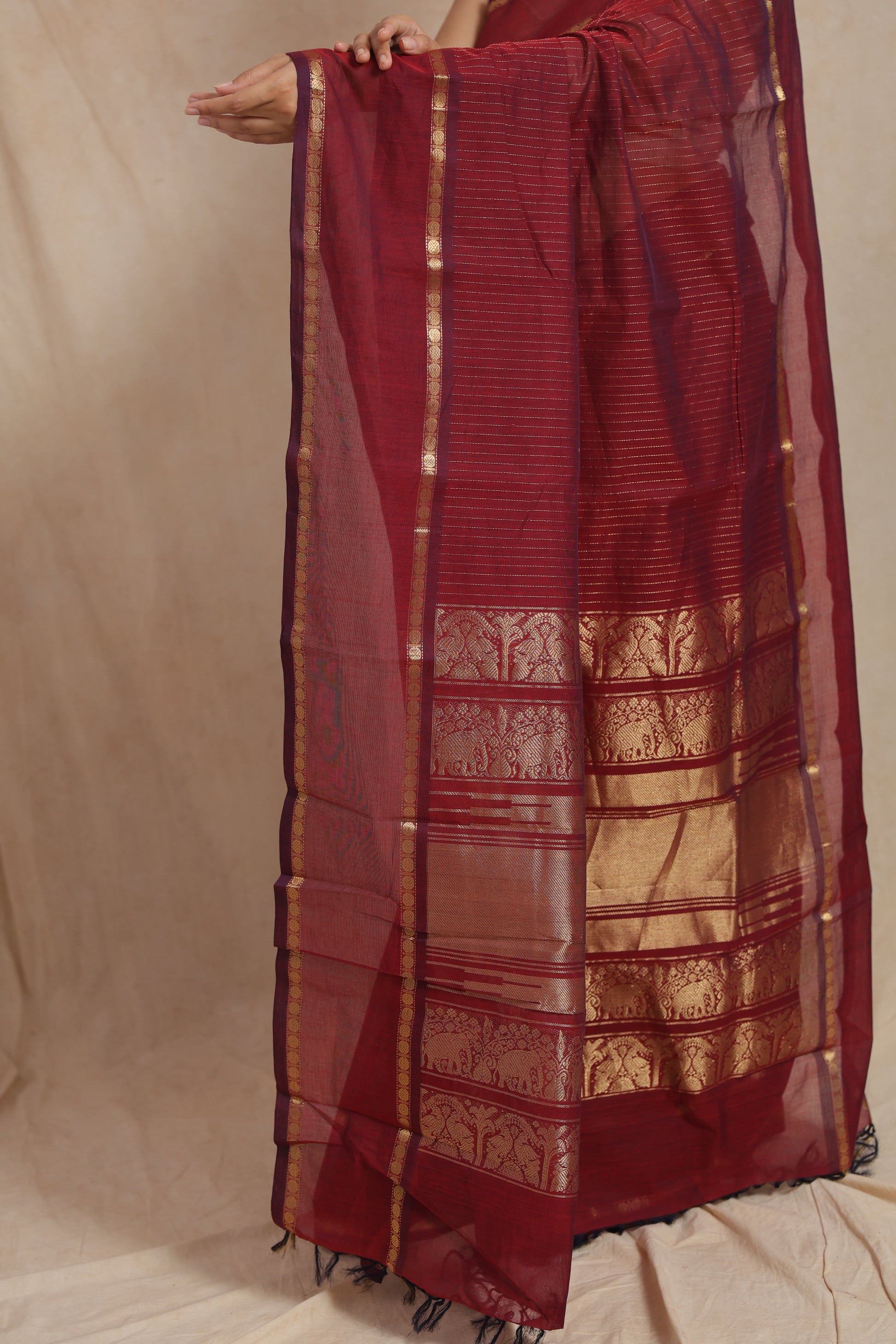 Detailed woven stripes on ruby red Kanchipuram cotton saree