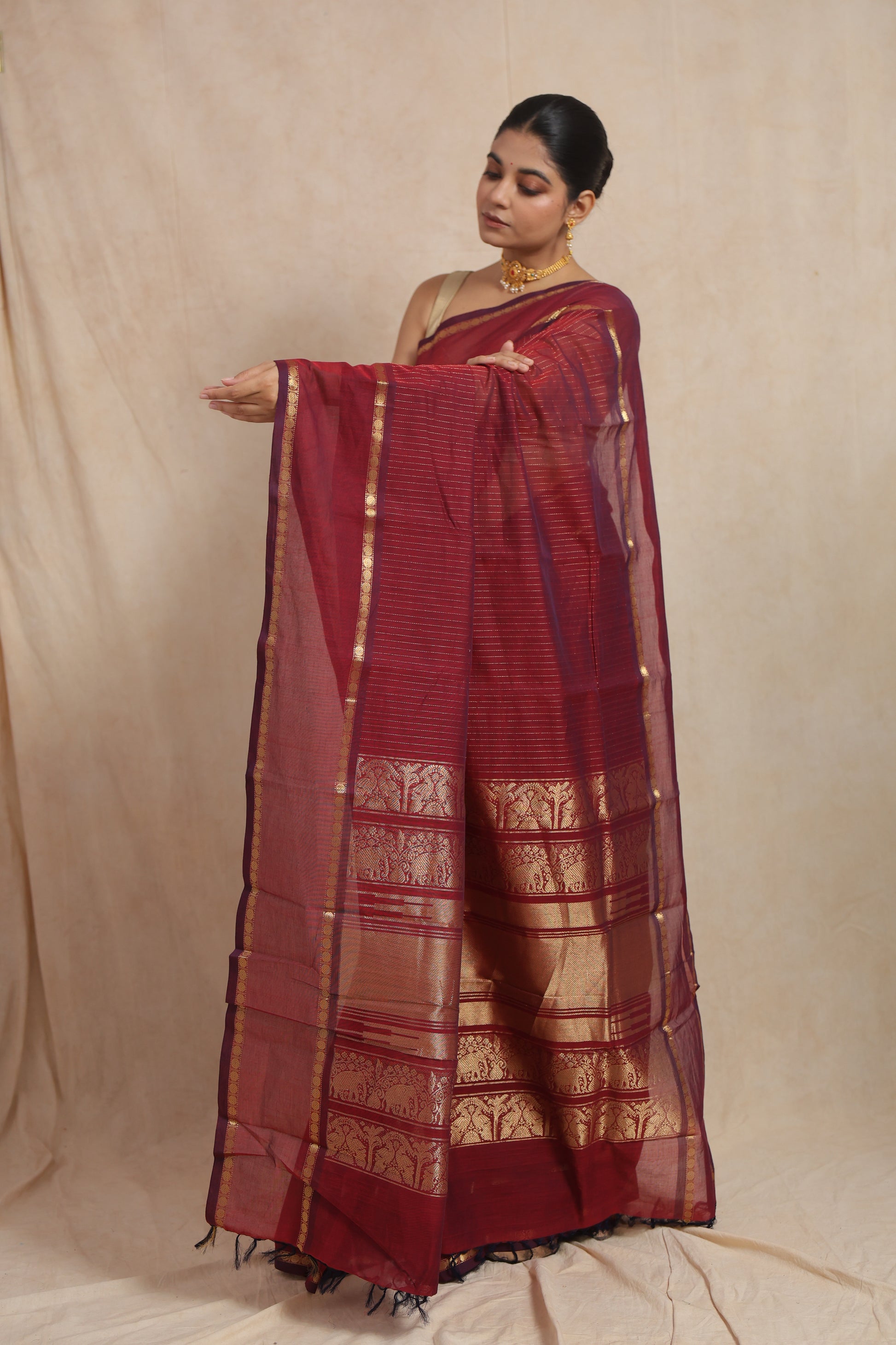 Close-up of woven pallu on ruby red Kanchipuram cotton saree