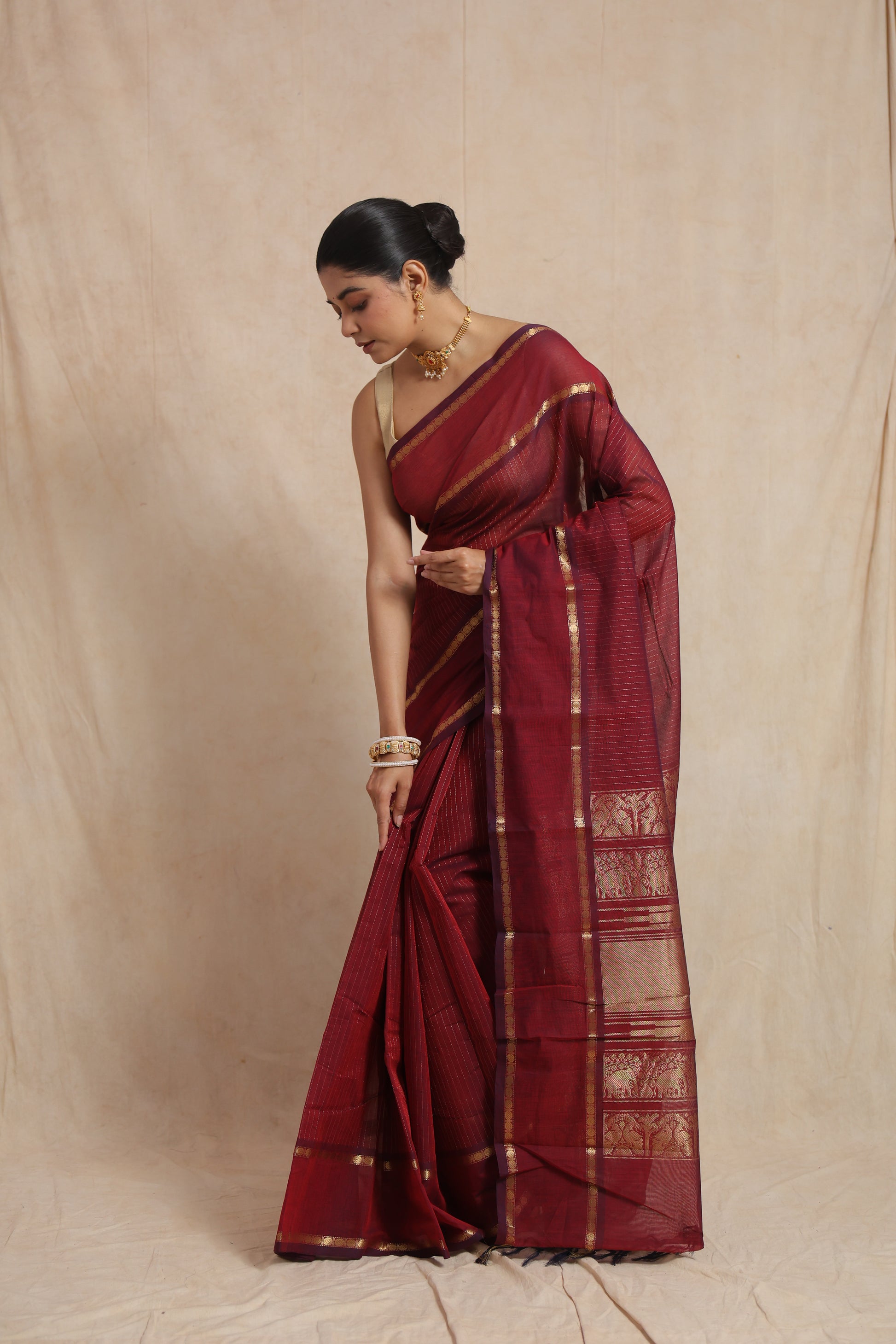 Portrait view of ruby red Kanchipuram cotton saree