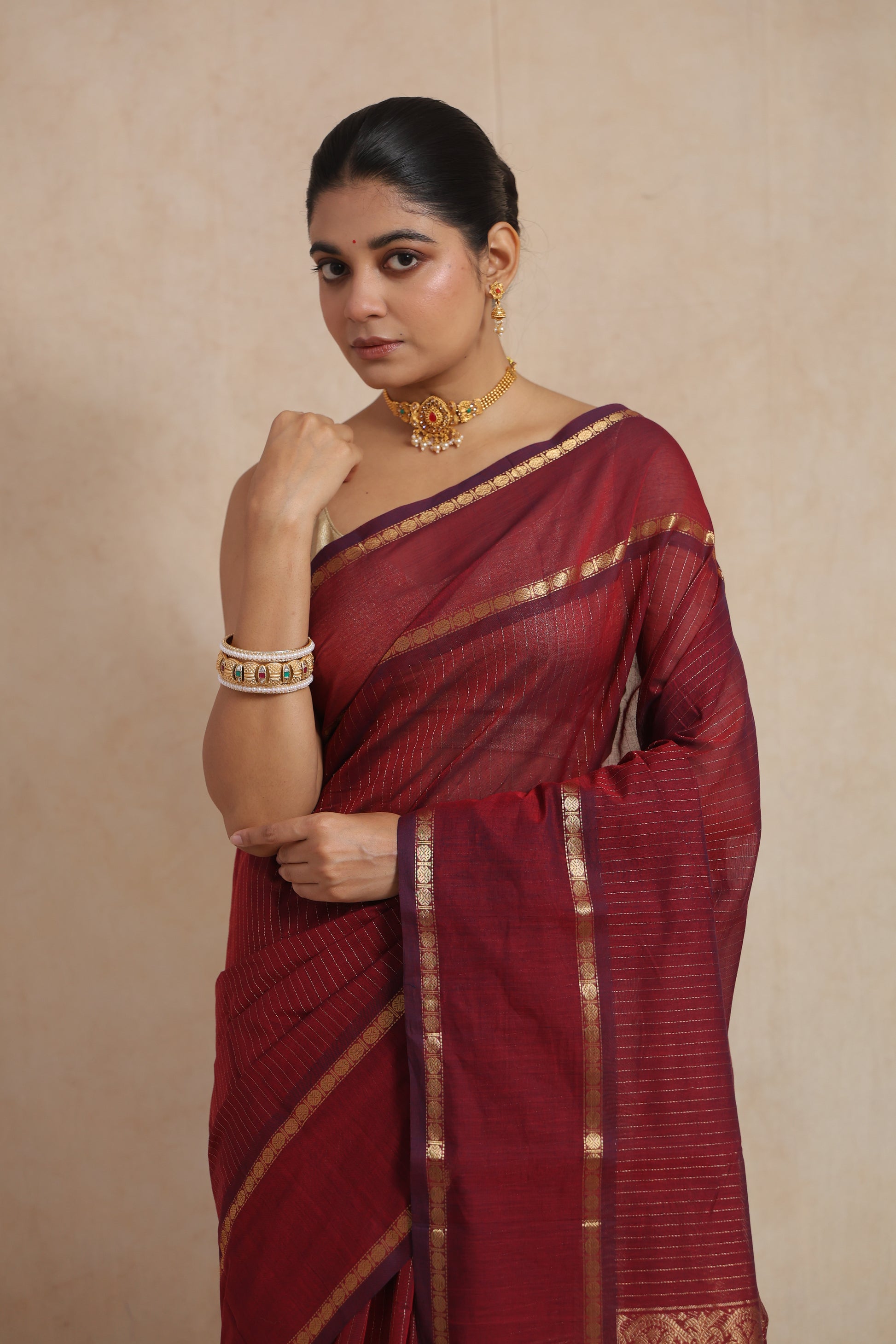 Side drape view of ruby red Kanchipuram cotton saree