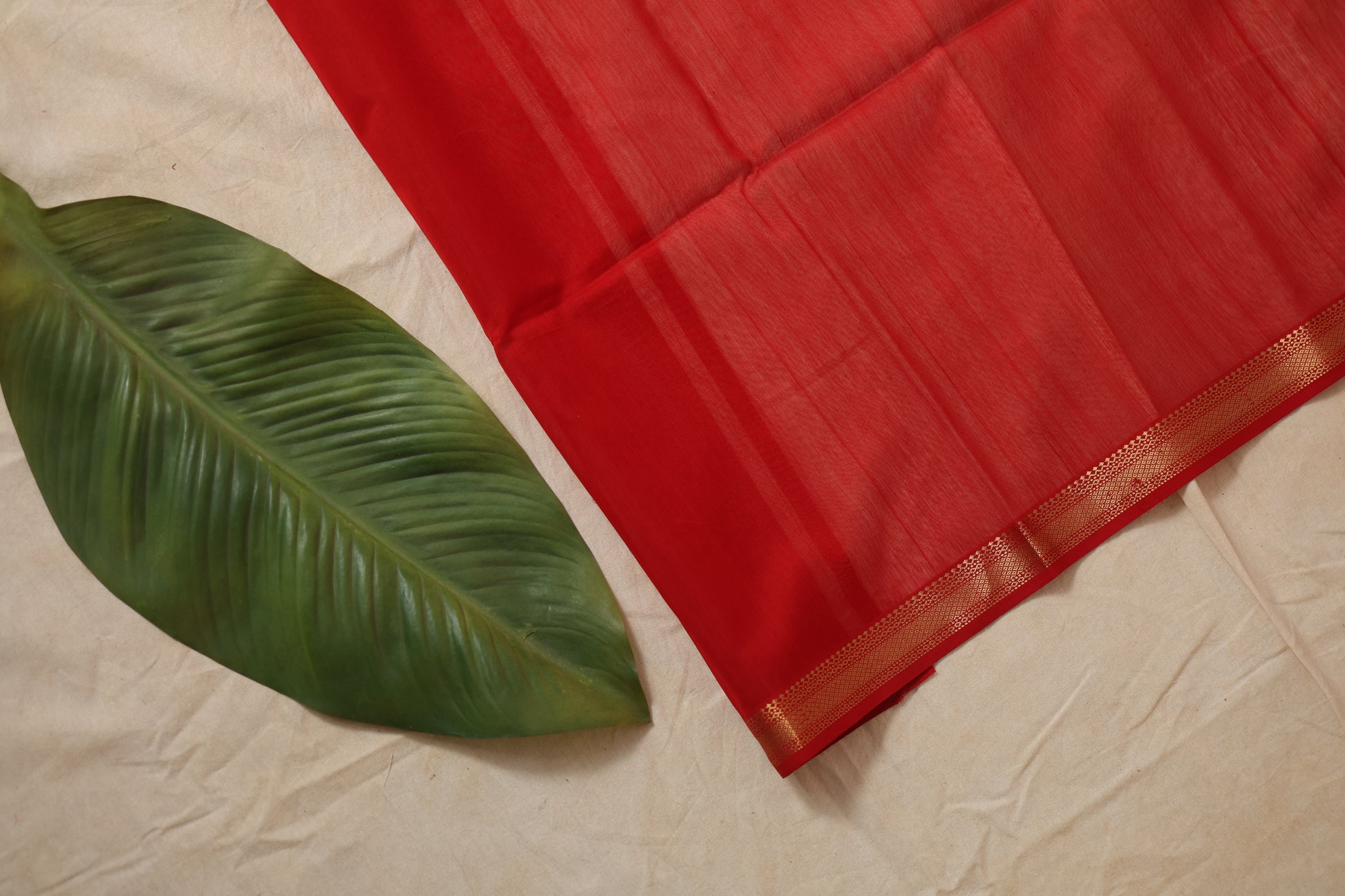 Close-up border detail of ruby red Maheshwari Sico saree