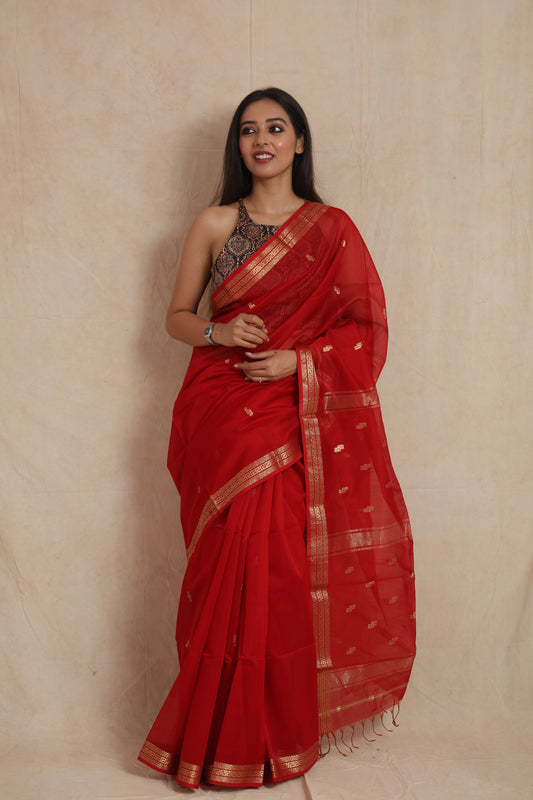 Front view of ruby red Maheshwari Sico saree with golden woven border