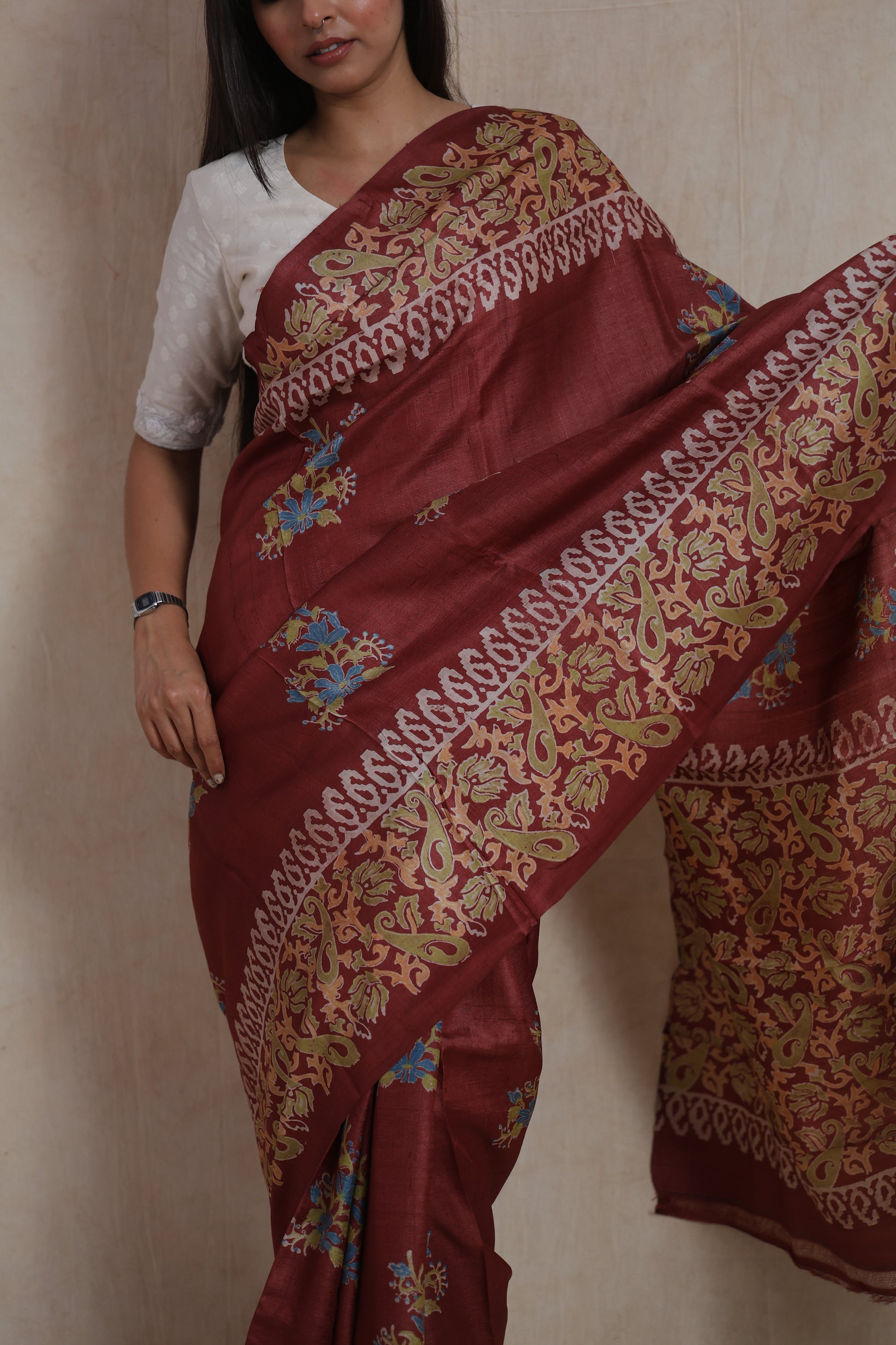 Front drape view of rust brown Batik silk saree with artistic woven border