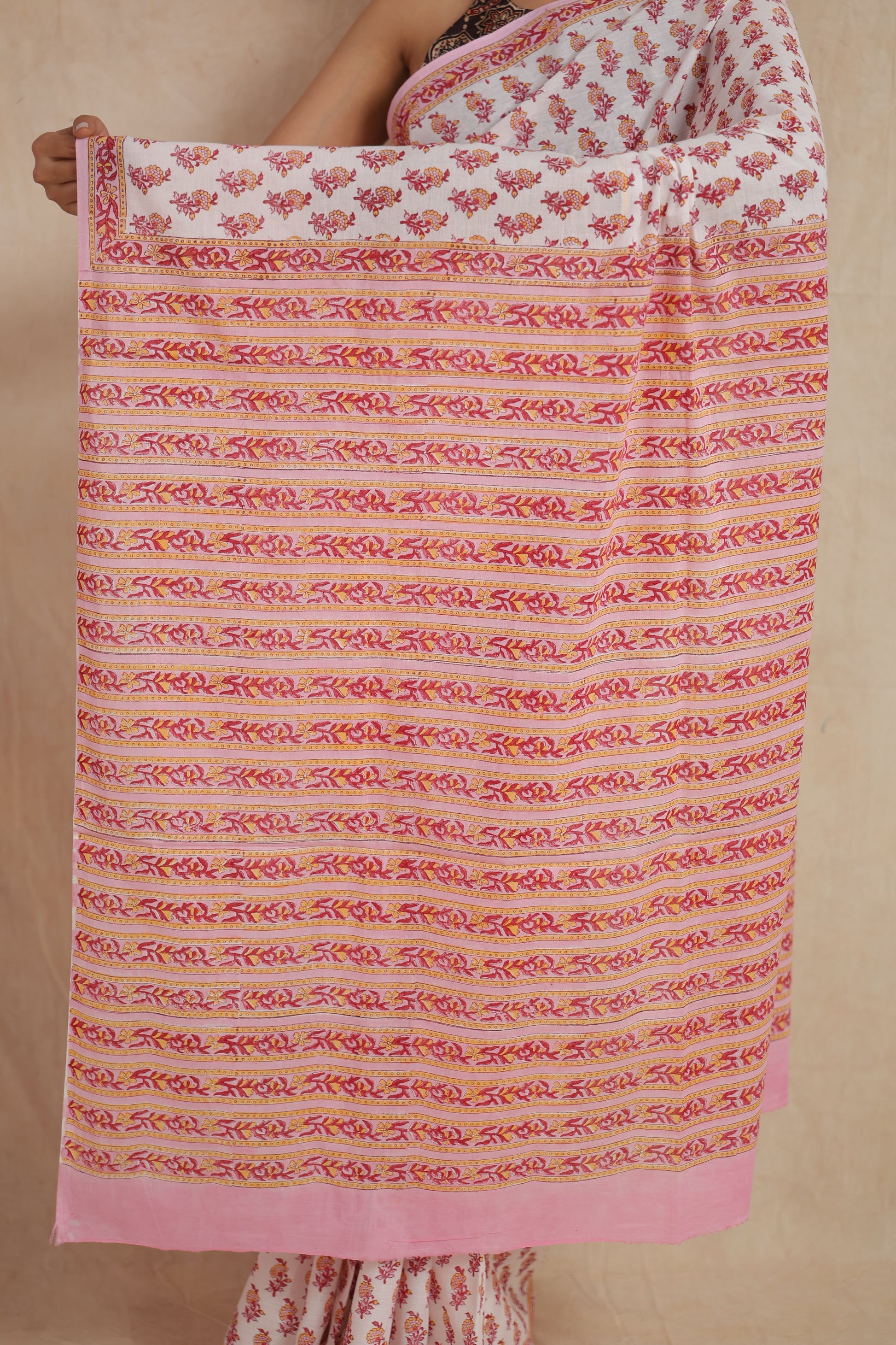 Close up of striped pallu design on pink Sanganeri cotton saree