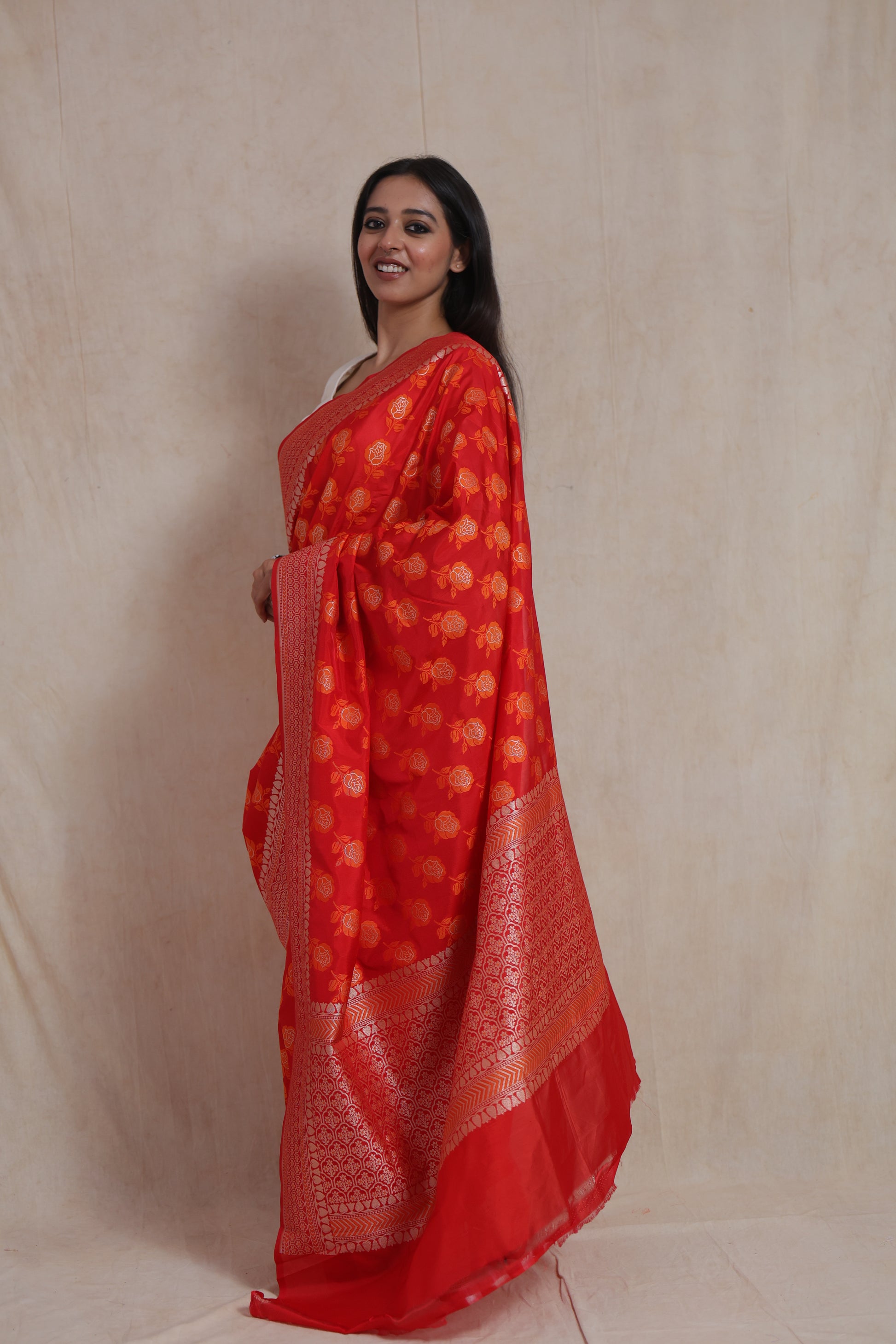 Side view of elegant red Banarasi art silk saree with rich woven pallu