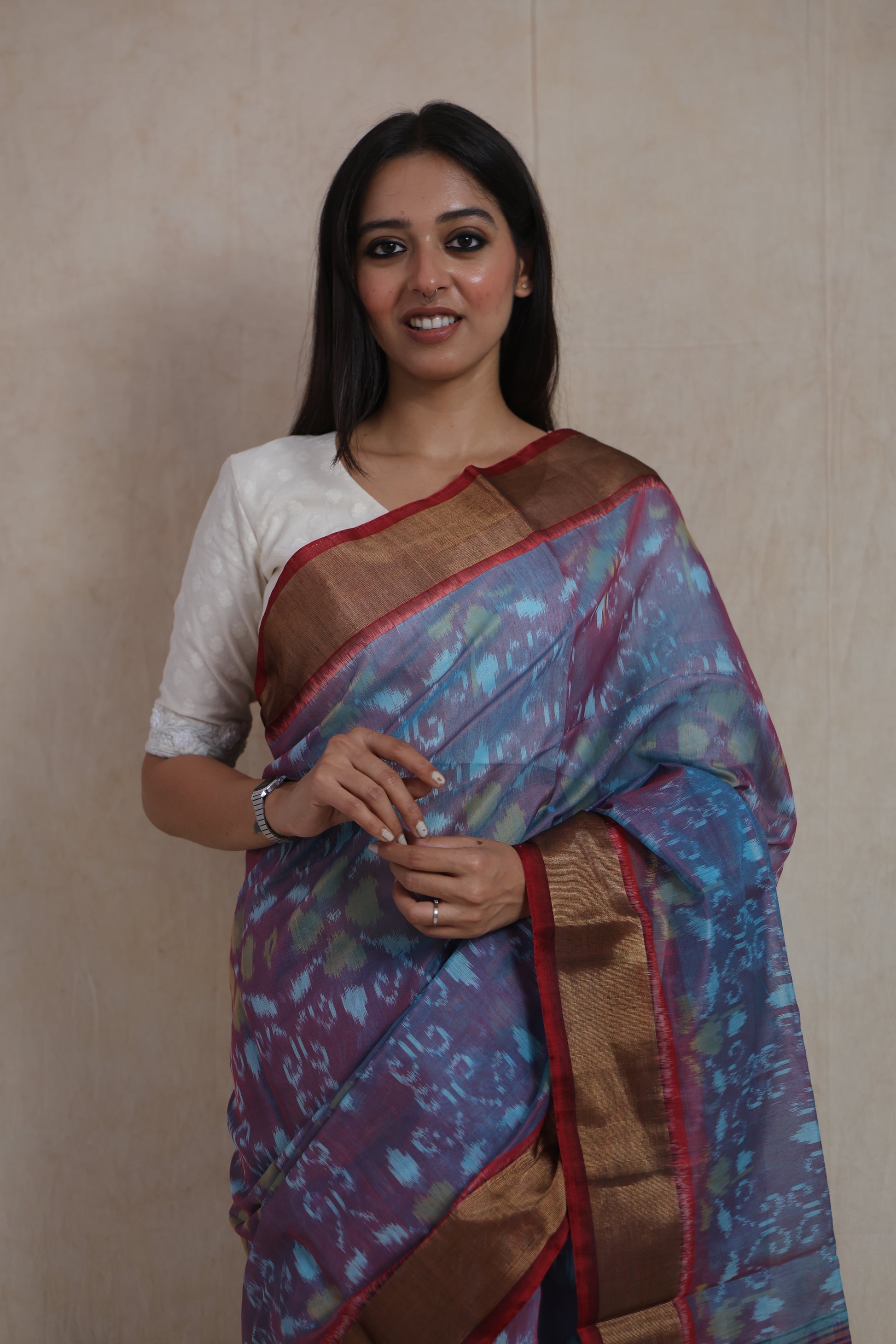 Close-up of Panchampali SICO saree showcasing intricate ikat motifs, copper border, and magenta pallu