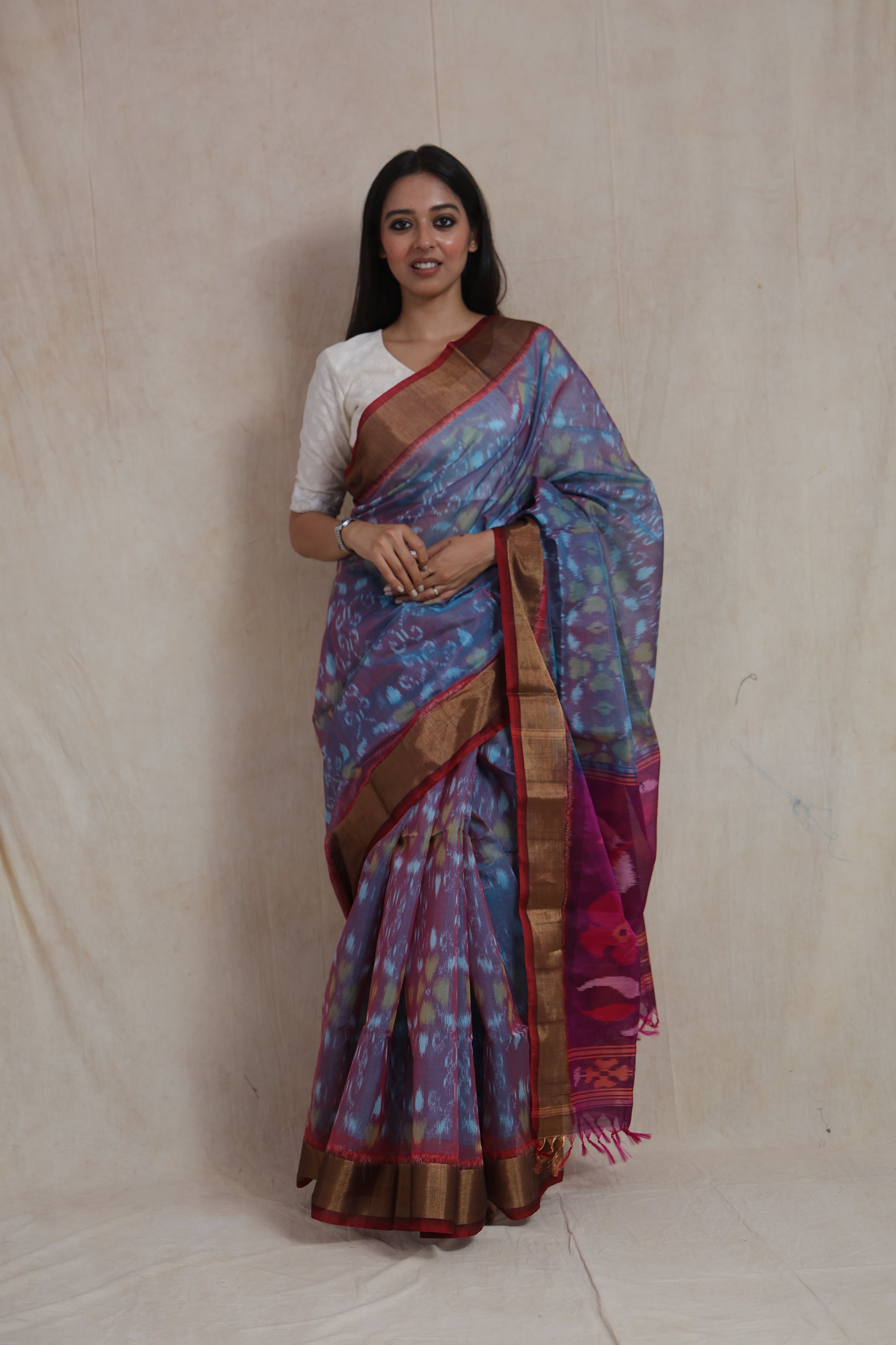 Front view of sky blue Panchampali SICO saree with copper-toned border and magenta floral pallu