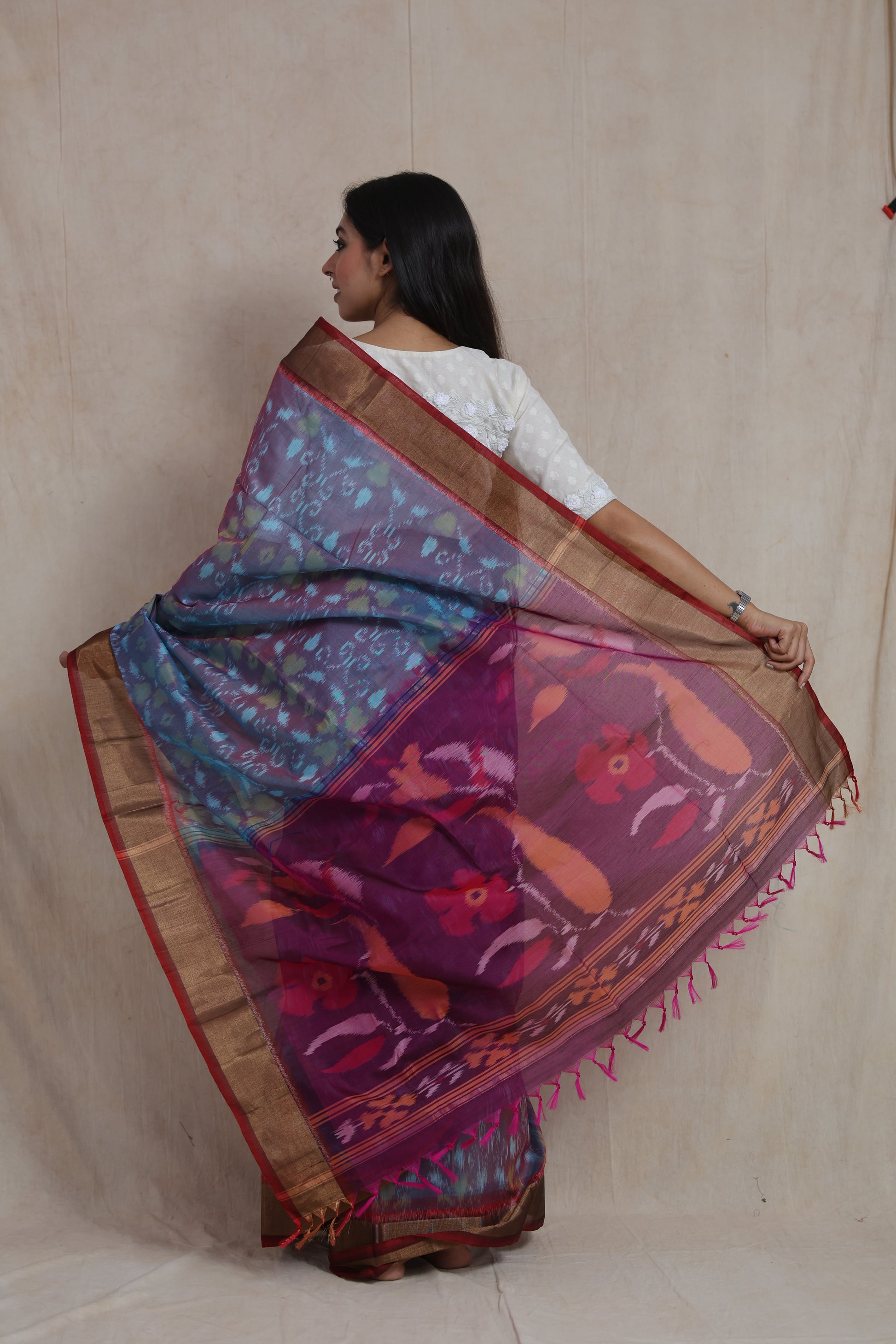 Back view displaying the artistic magenta floral pallu of a sky blue Panchampali SICO saree