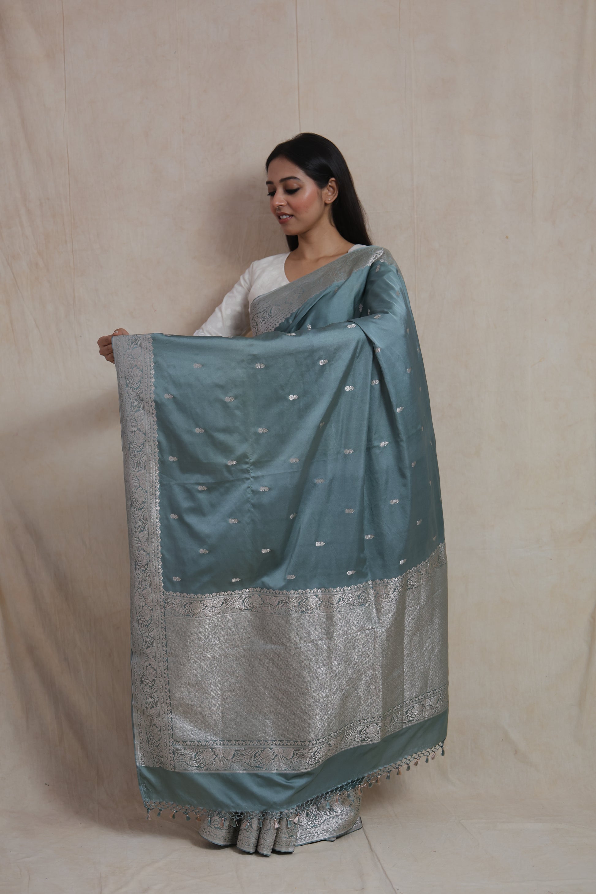 Full pallu display of steel blue Banarasi silk saree with silver zari motifs