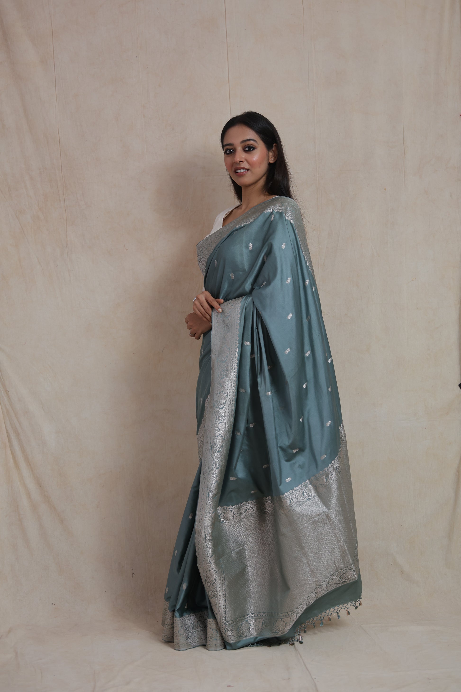 Side profile of steel blue Banarasi silk saree with silver zari woven pallu