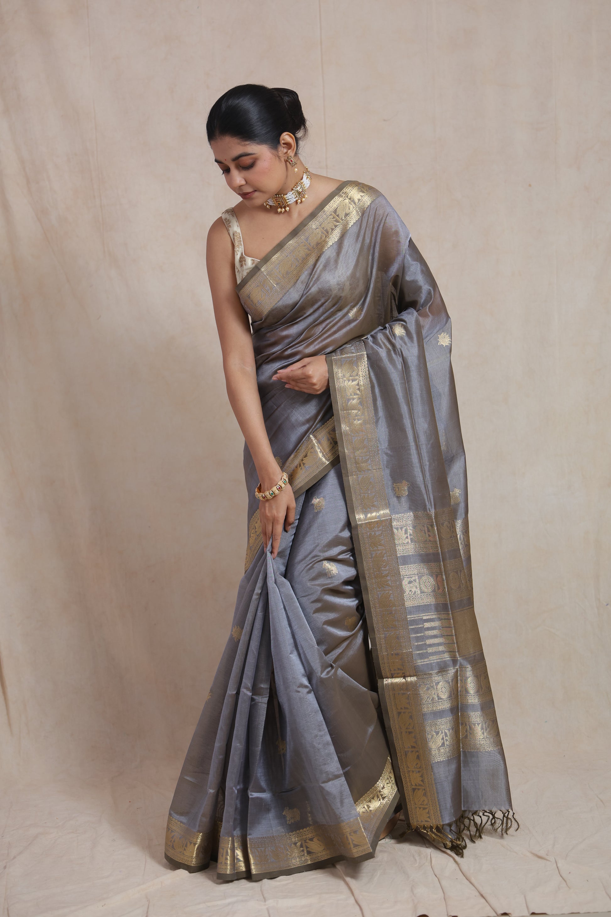 Front view of steel grey Kanchipuram Sico saree with gold zari border