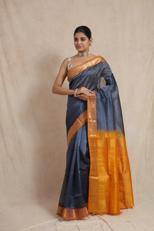 Full drape view of steel grey Kanchipuram Sico saree with golden woven pallu