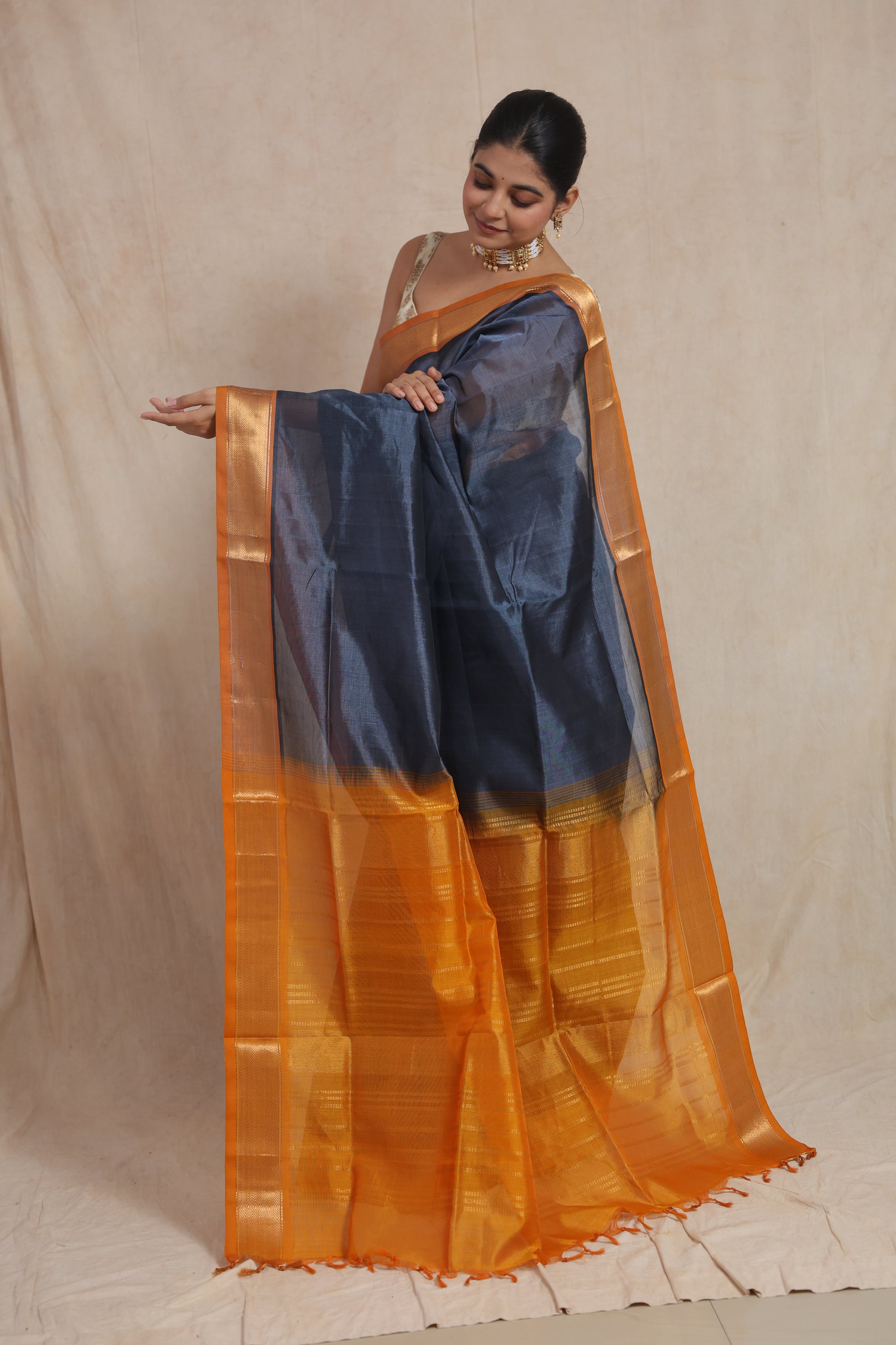 Detailed pallu view of steel grey Kanchipuram Sico saree with golden zari weaving