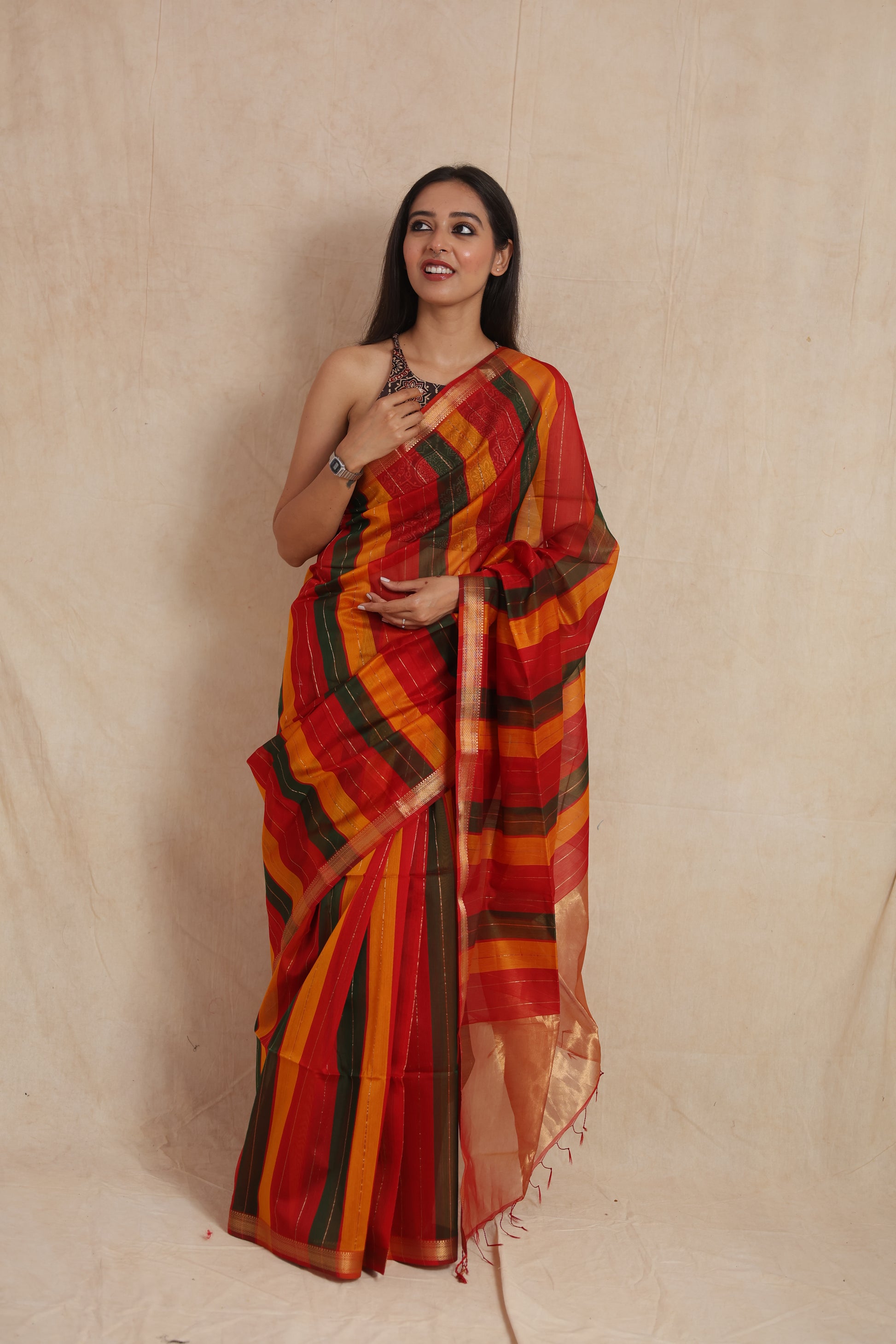 Full drape look of striped Maheshwari cotton saree with golden border