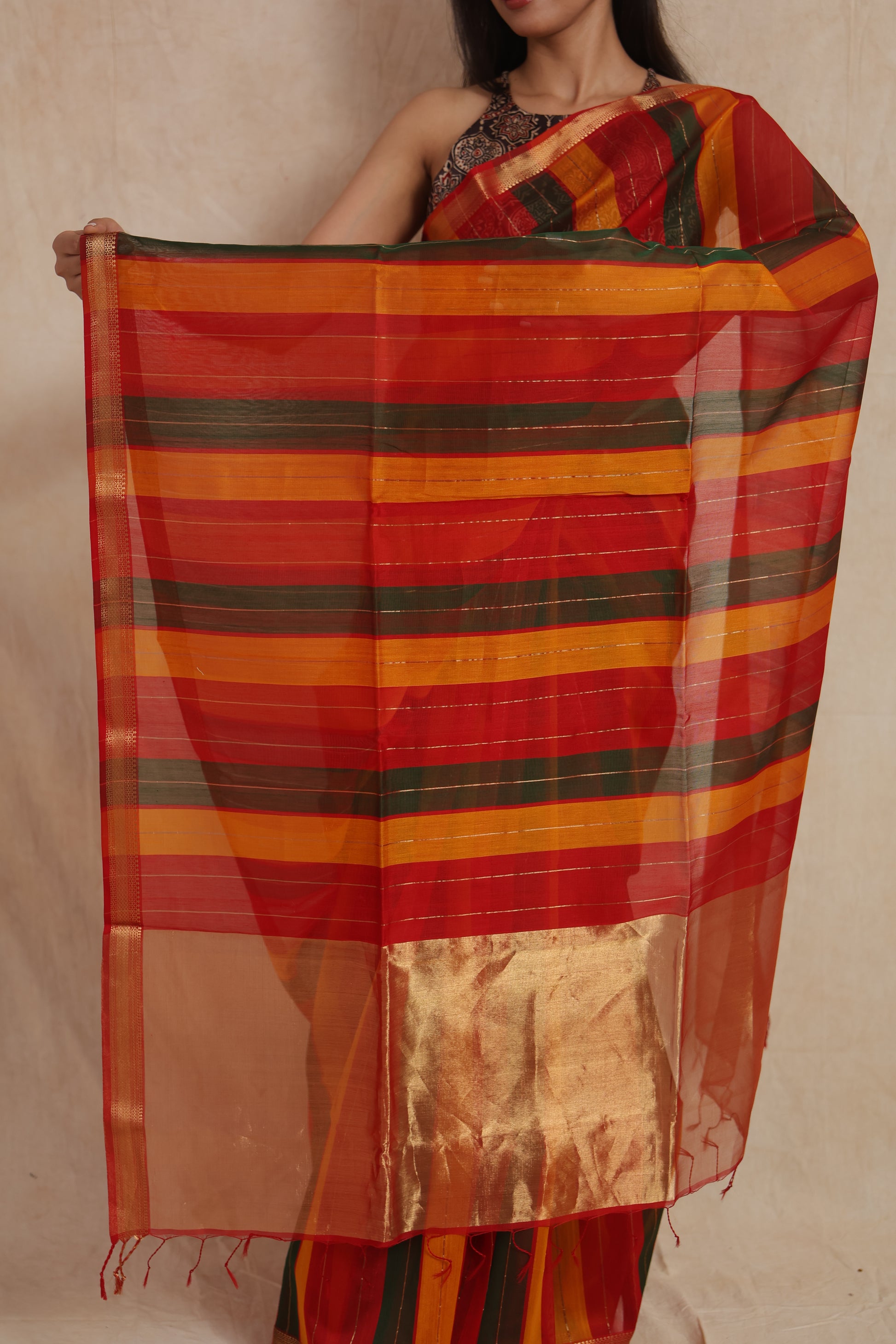 Close-up of striped Maheshwari cotton saree pallu and woven texture
