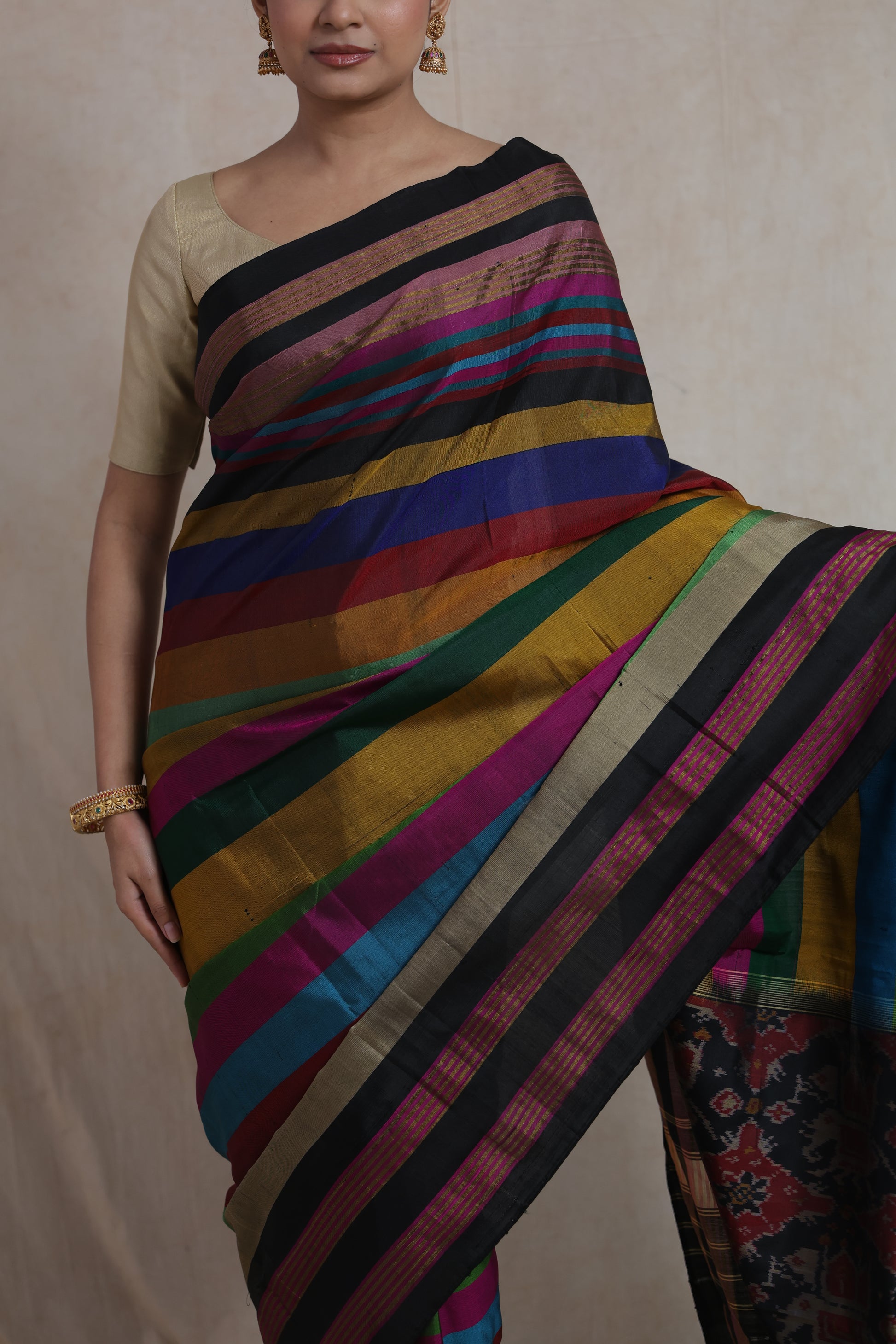 Close-up of multicolor striped Patola silk saree with elegant black border