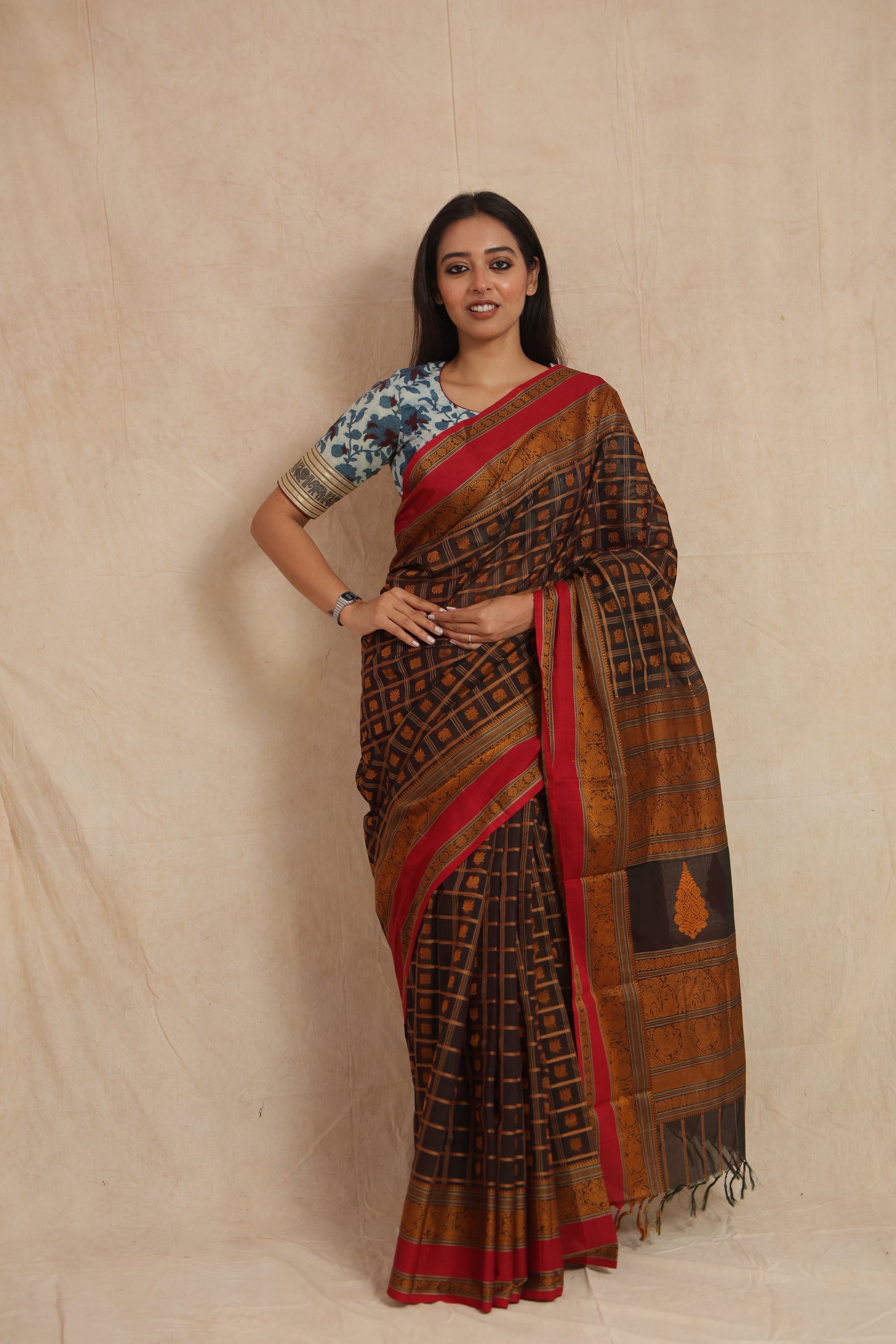Full-length look of black Kanchipuram cotton saree with woven checked body and rich pallu
