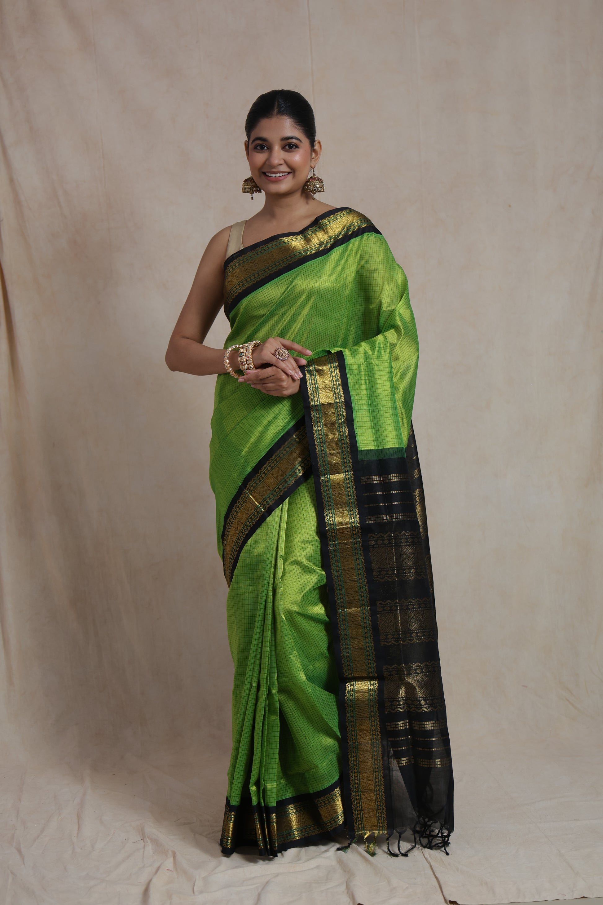 Traditional parrot green silk cotton saree with rich black pallu