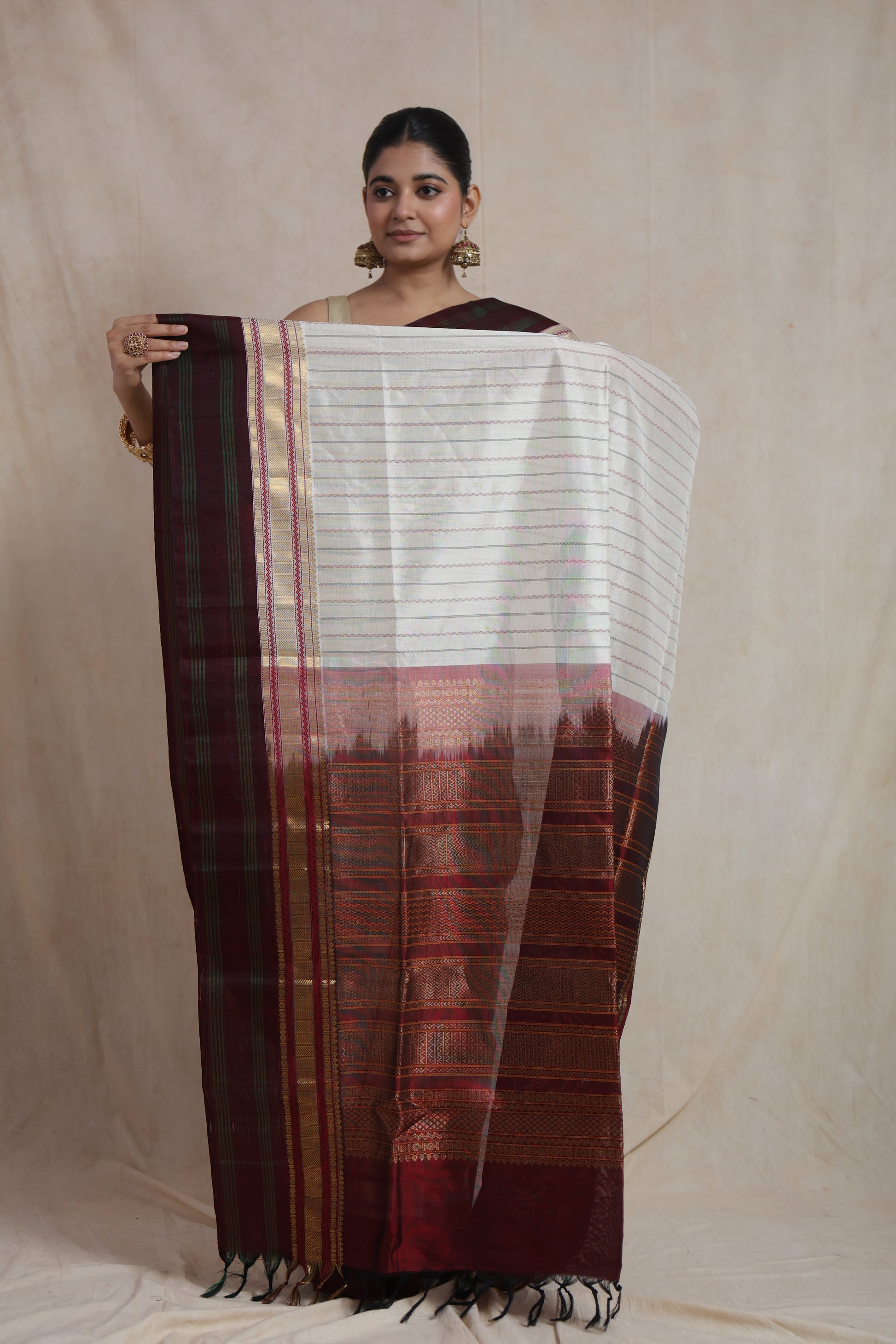 Full view of off white Kanchipuram silk cotton saree with woven stripes