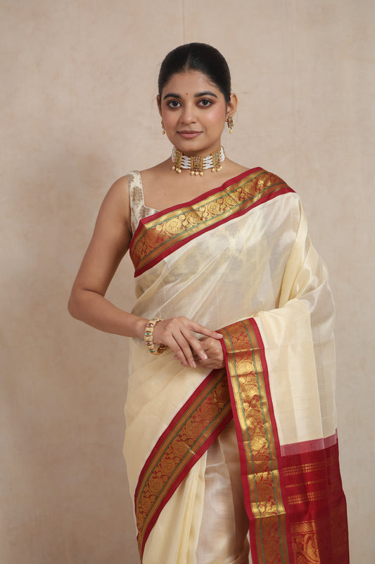 Front look of traditional off-white Kanchipuram Sico saree with crimson zari border