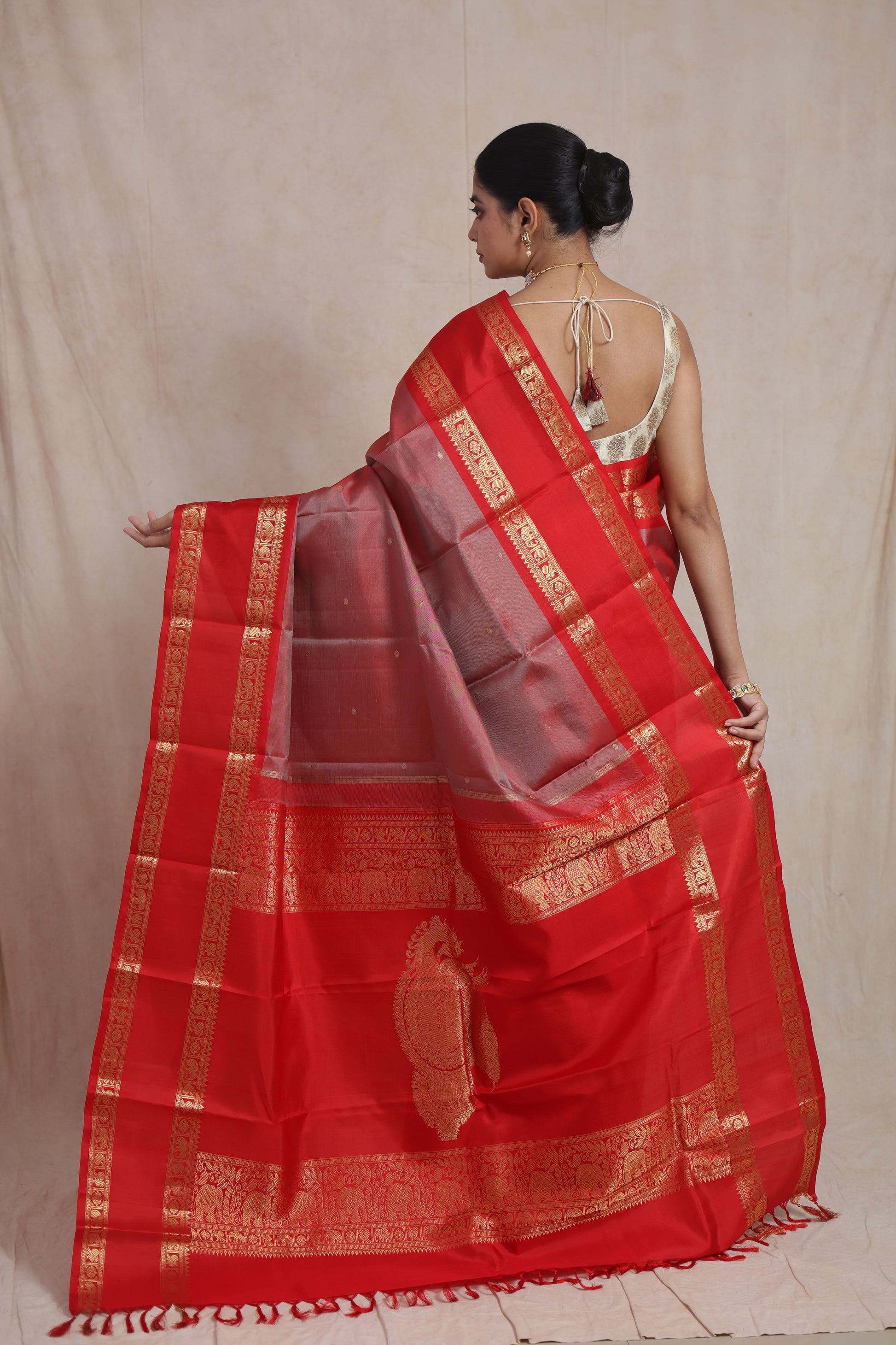 Full view of traditional royal red Kanchiwaram silk saree with zari border
