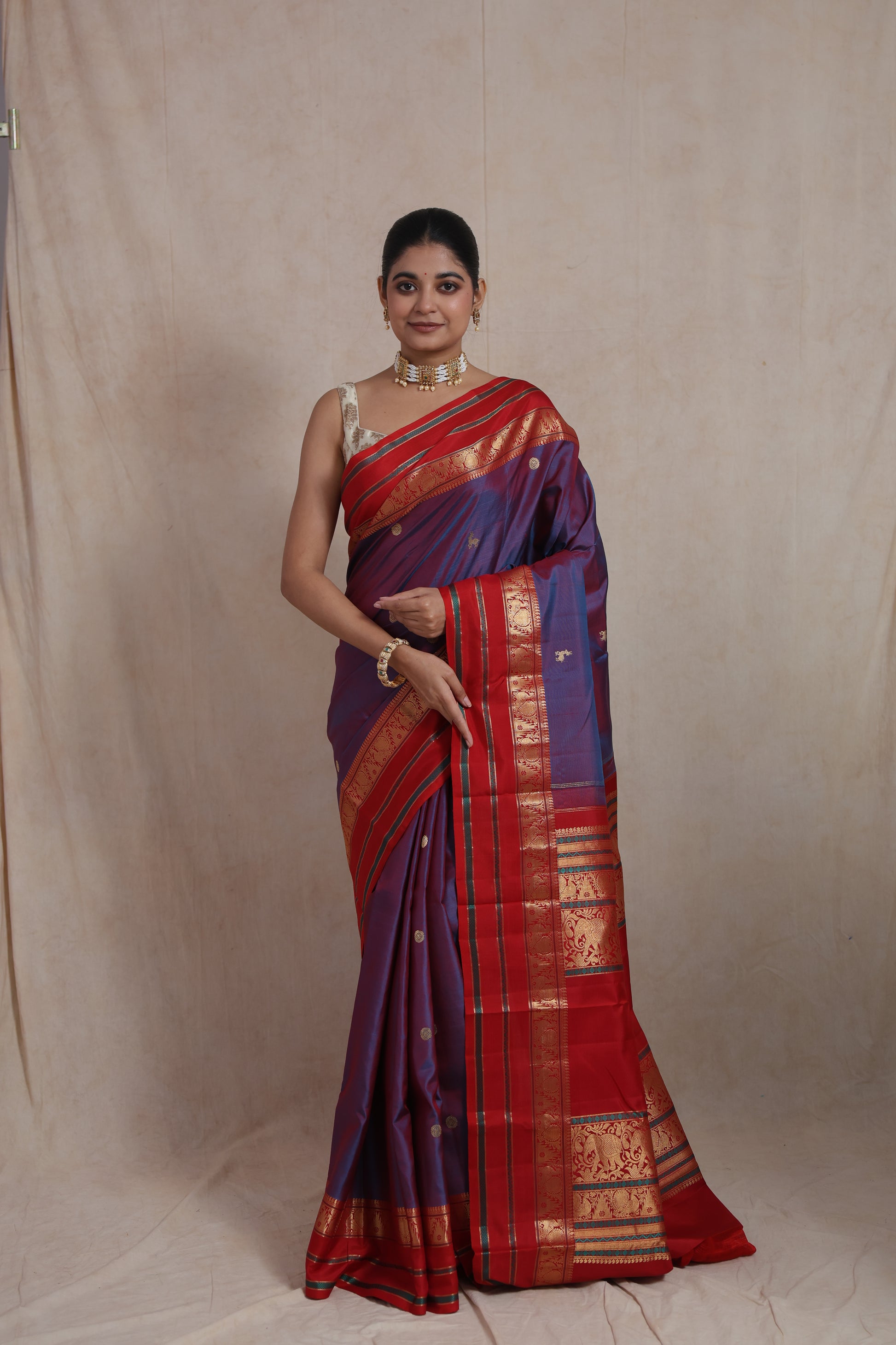 Full standing pose in royal violet Kanjivaram silk saree