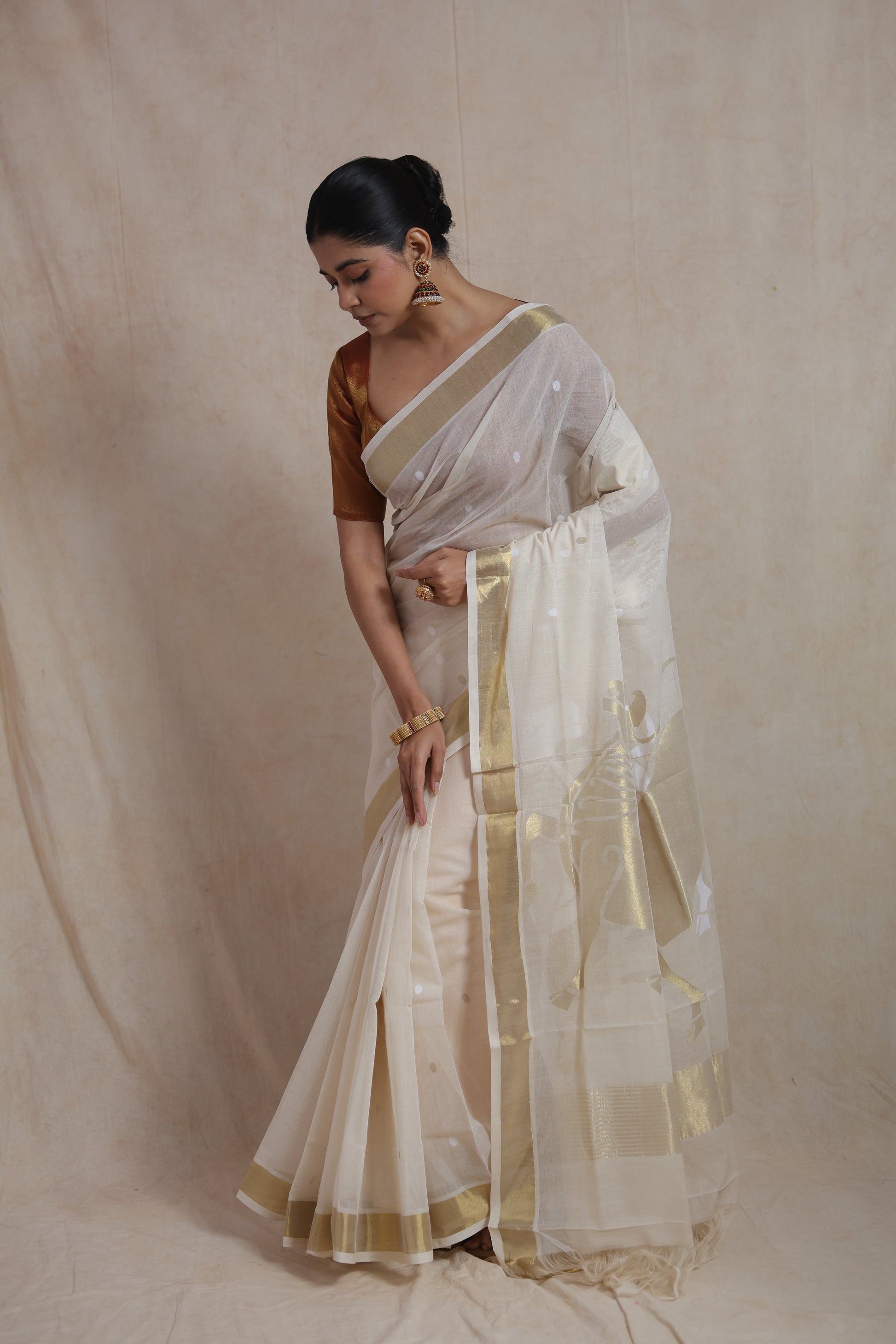 Elegant off white Kanchipuram cotton saree for festive and traditional wear