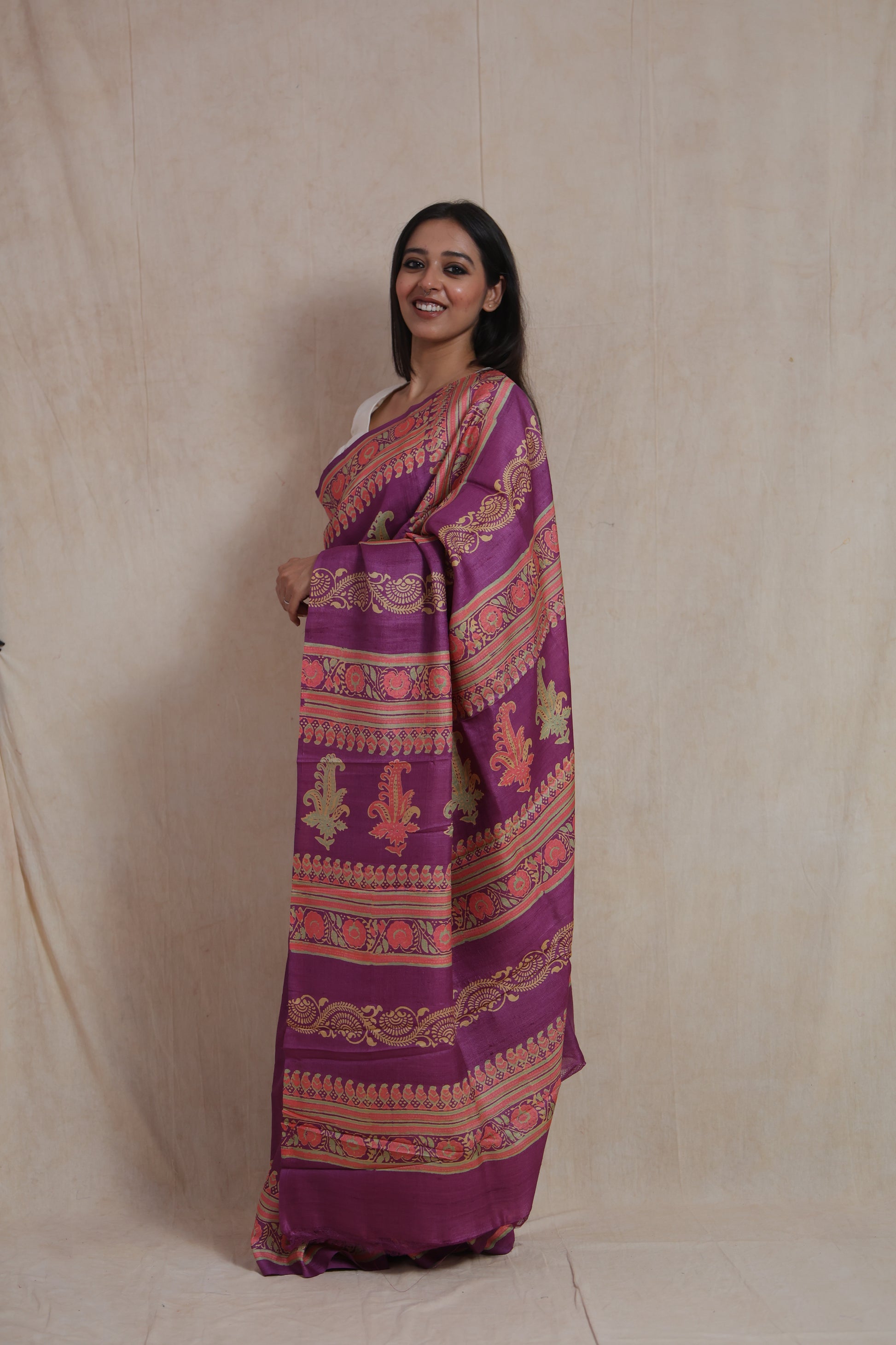 Side profile of purple Tussar Batik print saree with artistic pallu
