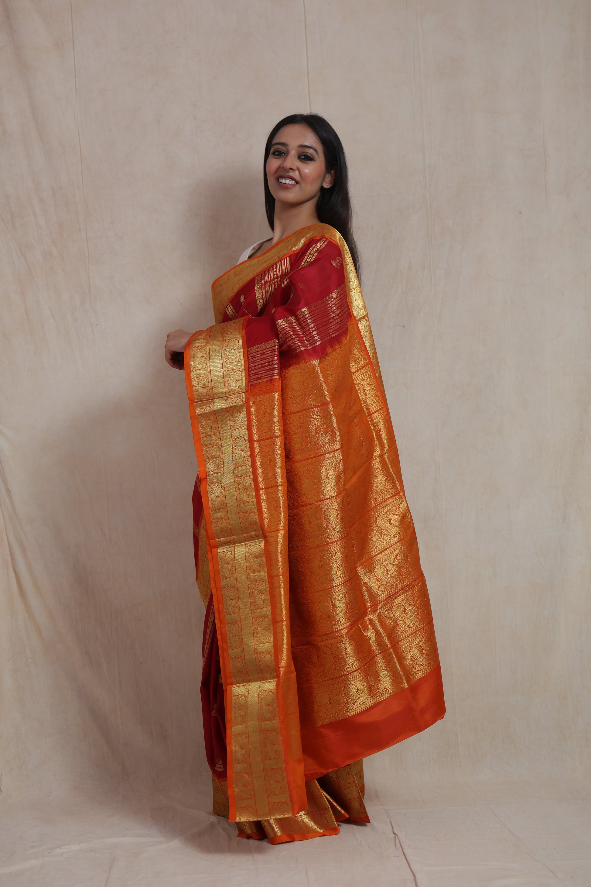 Side profile of Venkatgiri handloom silk saree with ornate orange pallu and woven detailing