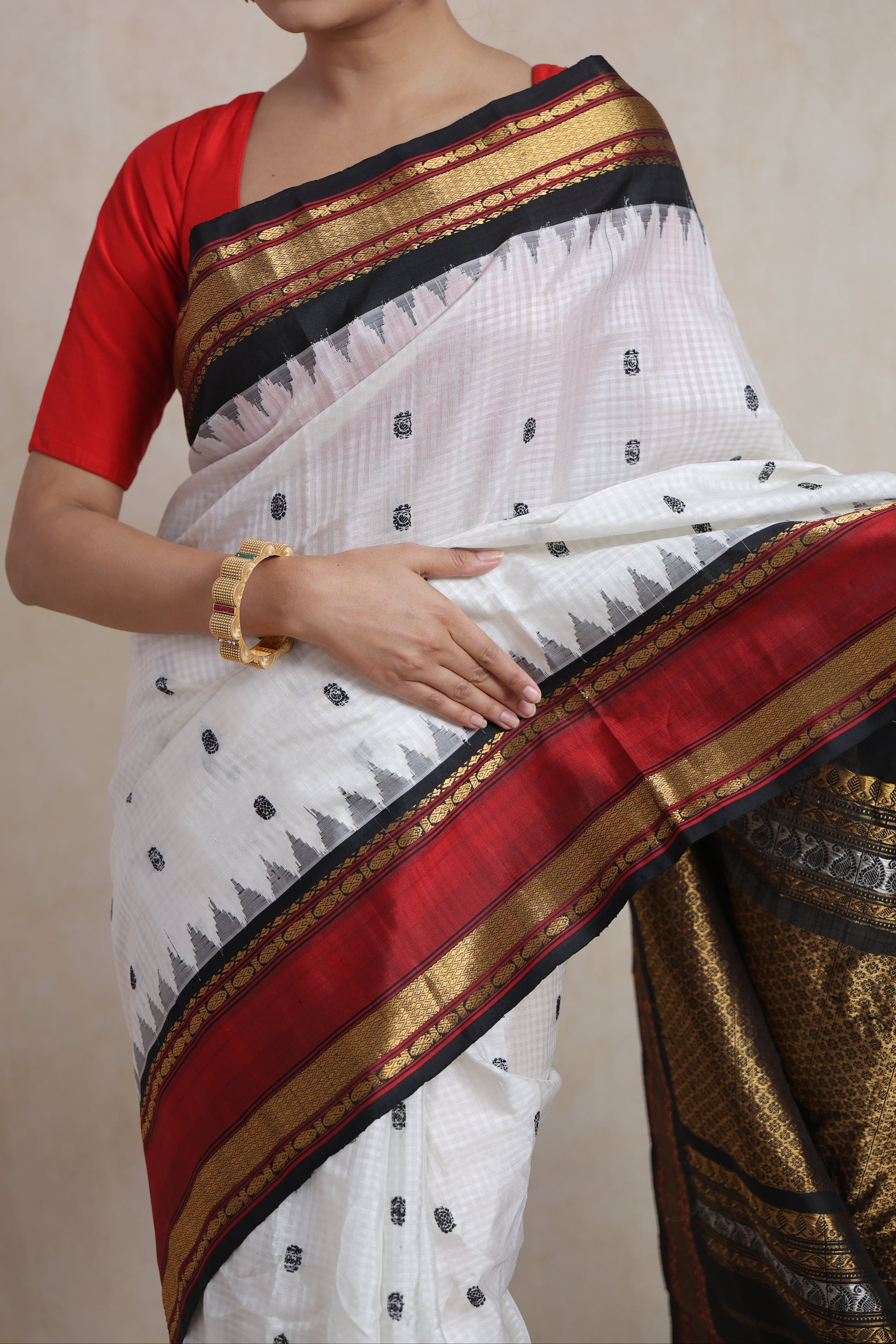 Traditional white Gadwal silk saree for festive occasions
