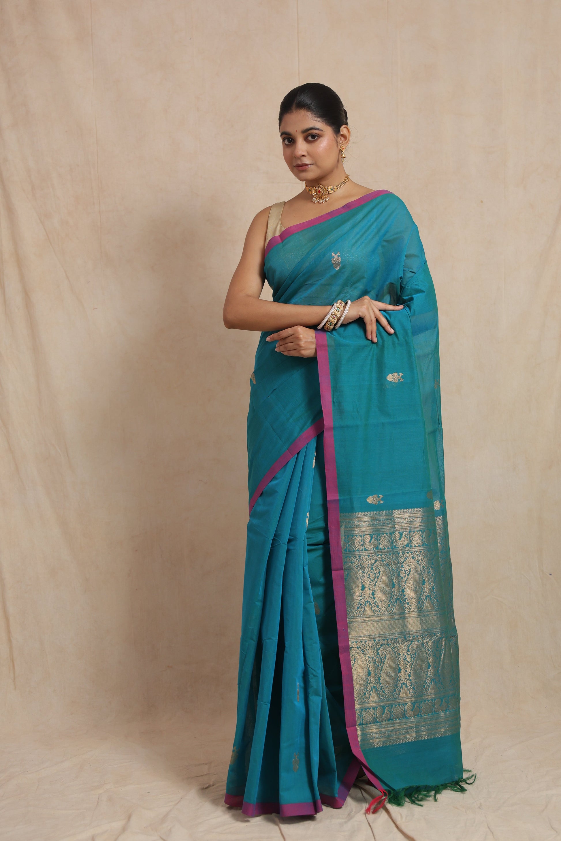 Turquoise blue Kanchipuram handloom cotton saree with magenta border and traditional woven pallu
