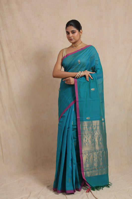 Turquoise blue Kanchipuram handloom cotton saree with magenta border and traditional woven pallu