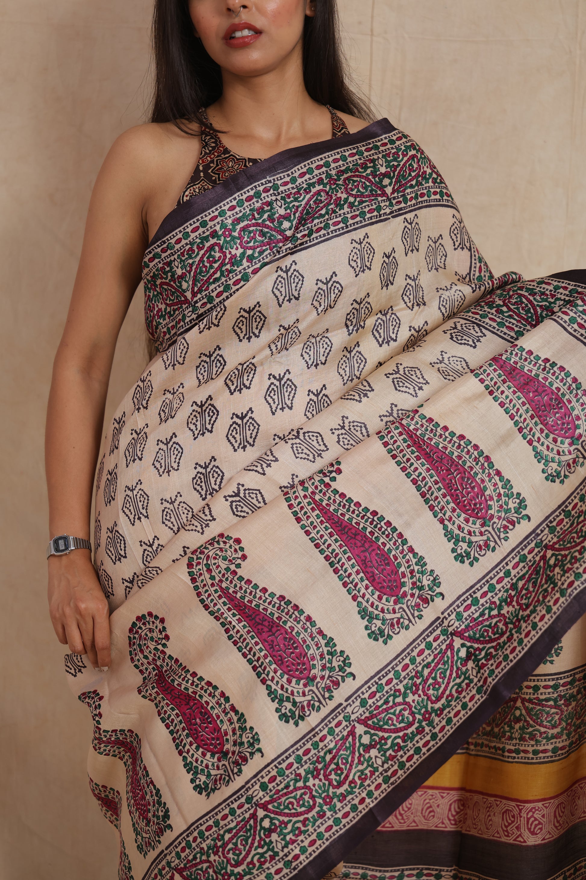 Close-up of ivory Tussar print saree showcasing intricate floral and paisley motifs