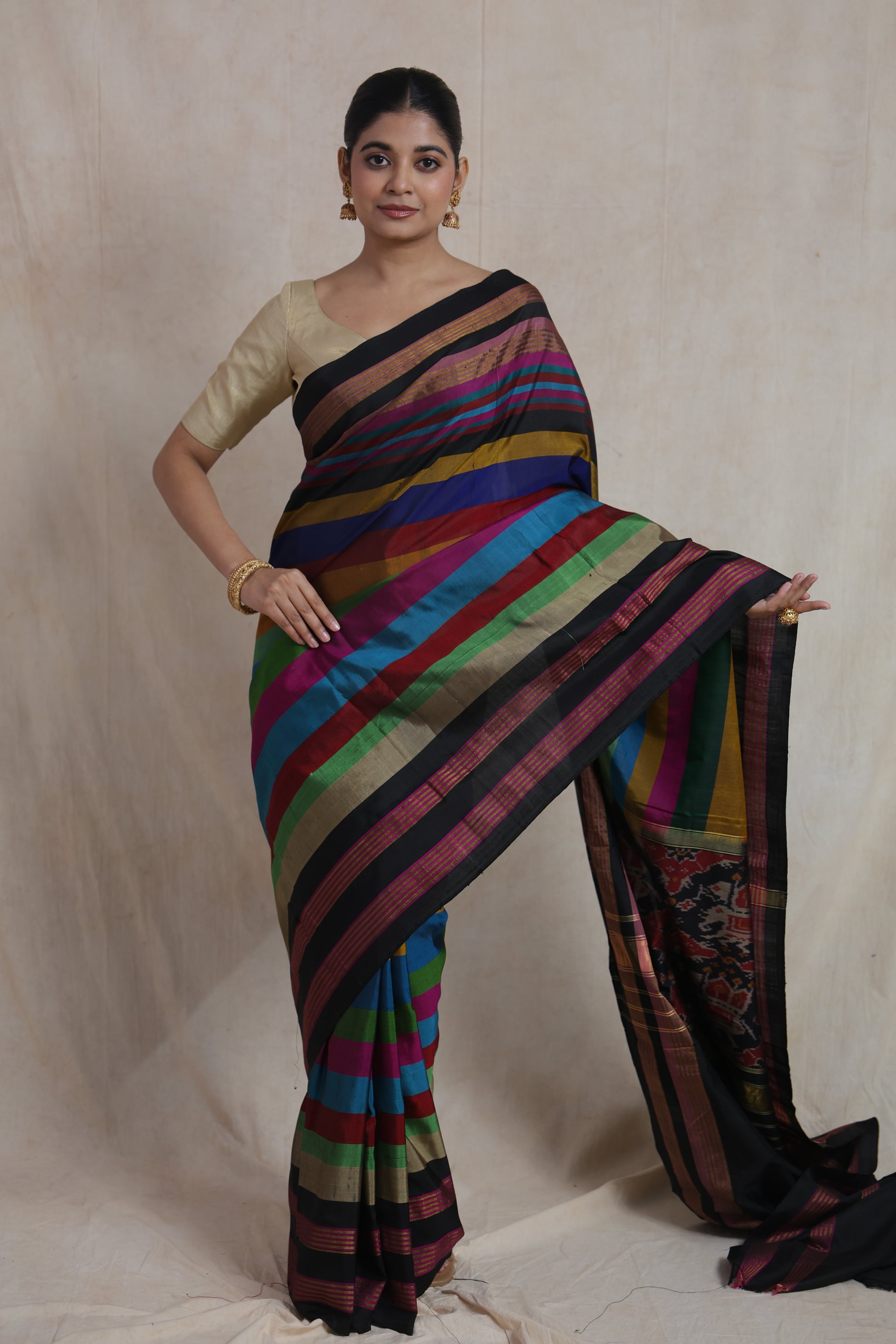 Front pose of vibrant multicolor Patola silk saree with striped design