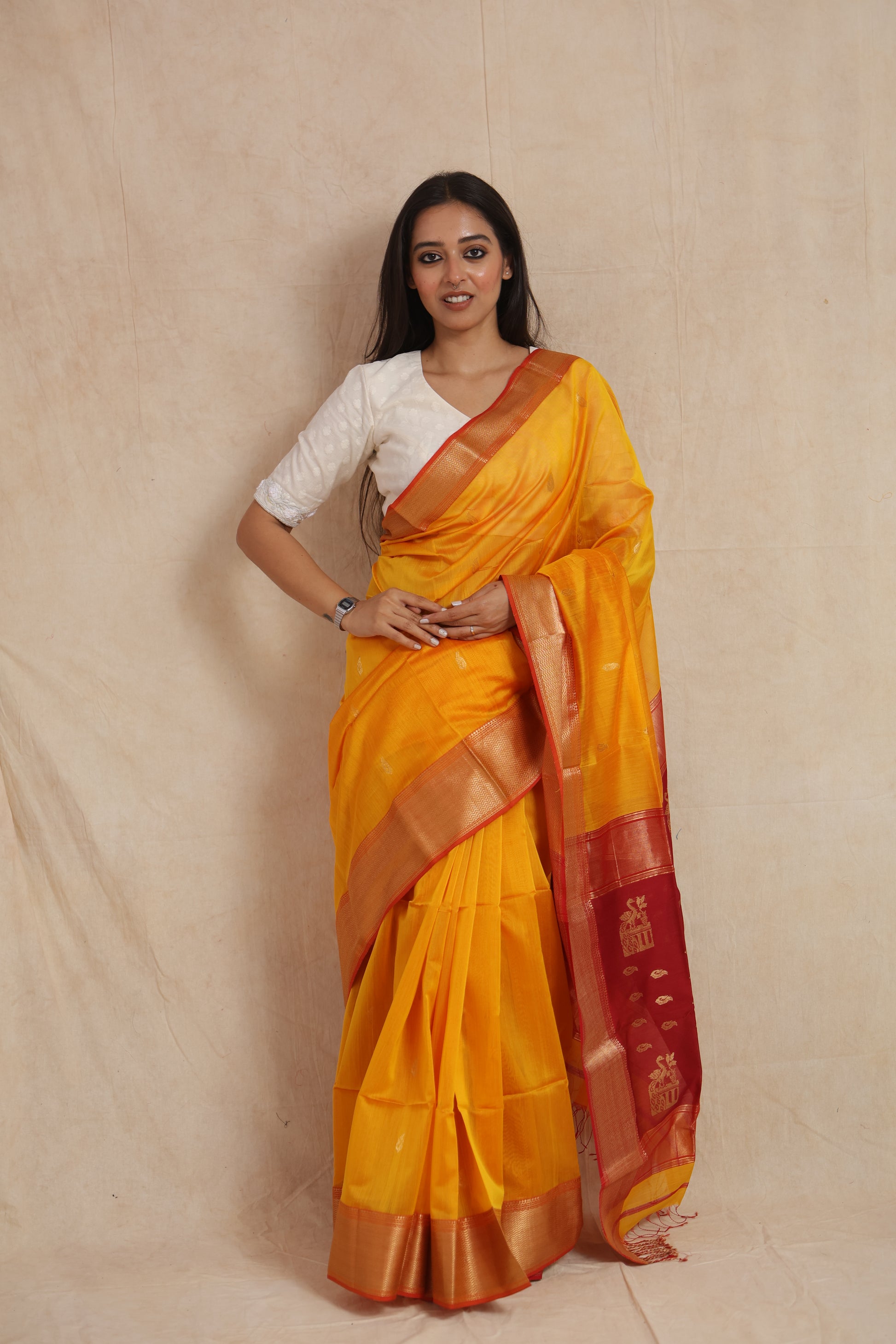 Front view of yellow Maheshwari SICO saree with red zari pallu