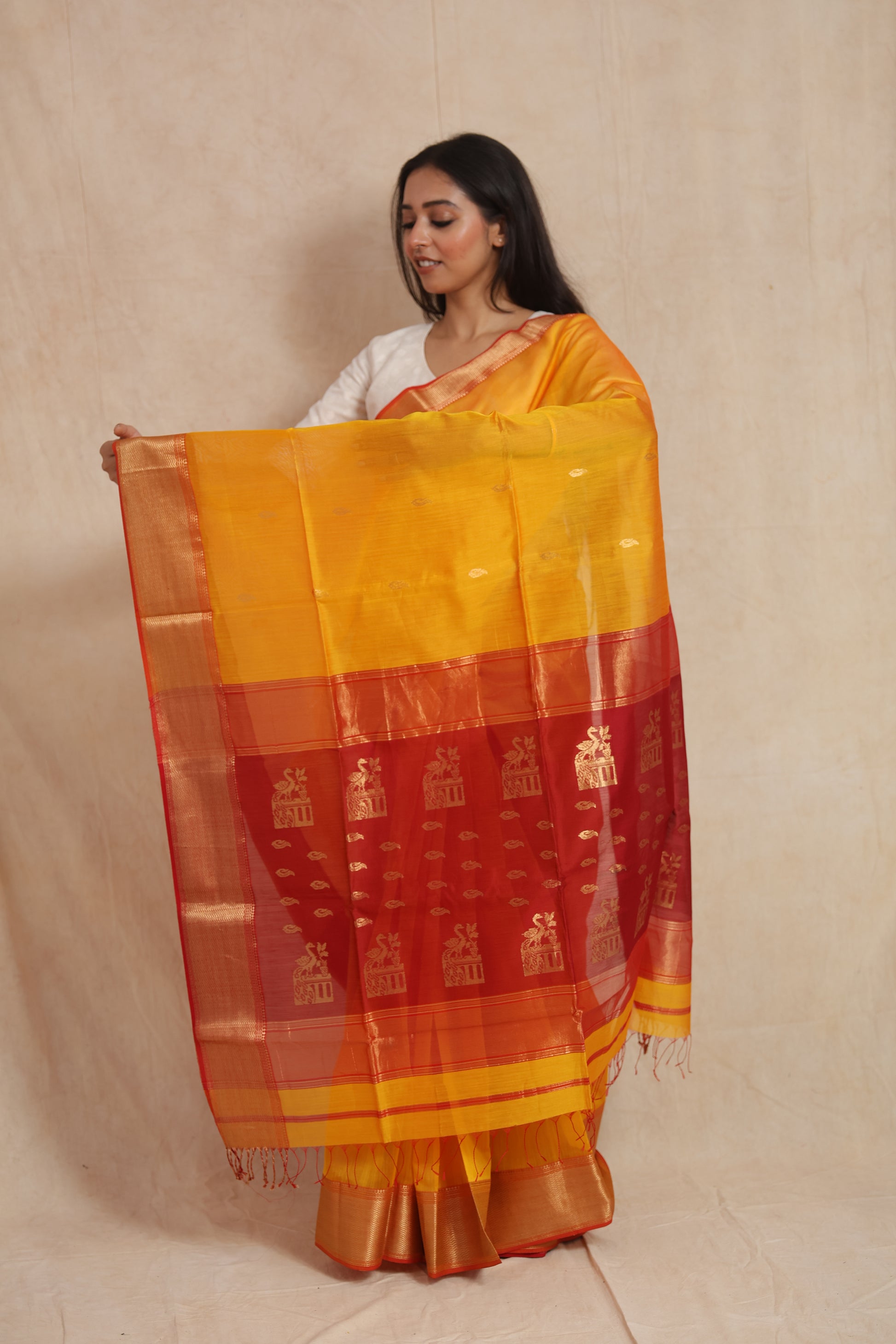 Full pallu display of yellow Maheshwari SICO saree with zari motifs