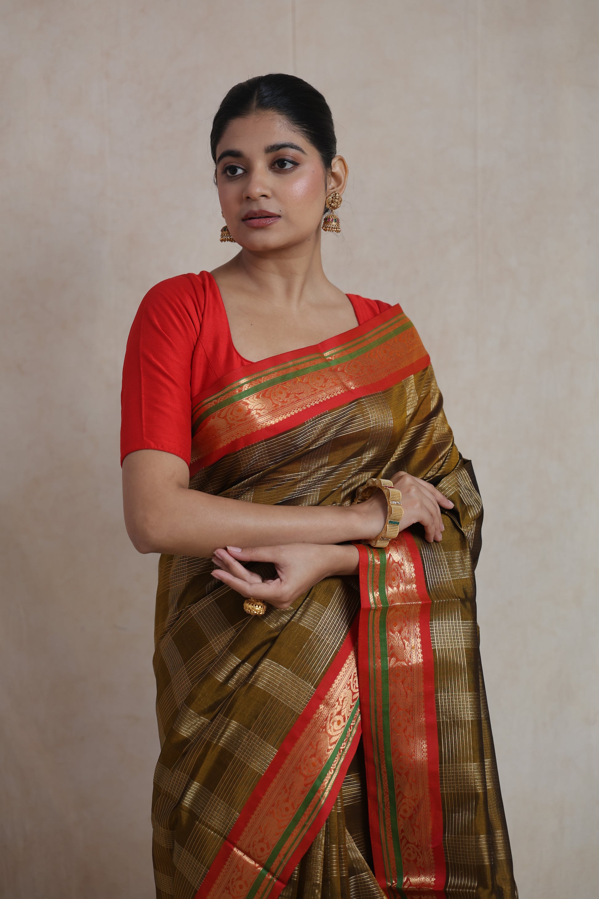 Olive gold silk cotton saree with shimmering zari checks